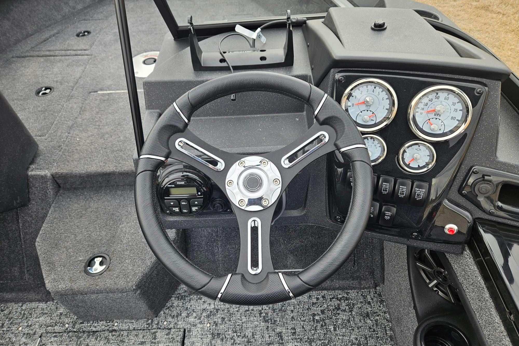 2026 Tracker Targa V-19 WT boat dashboard with steering wheel and gauges.