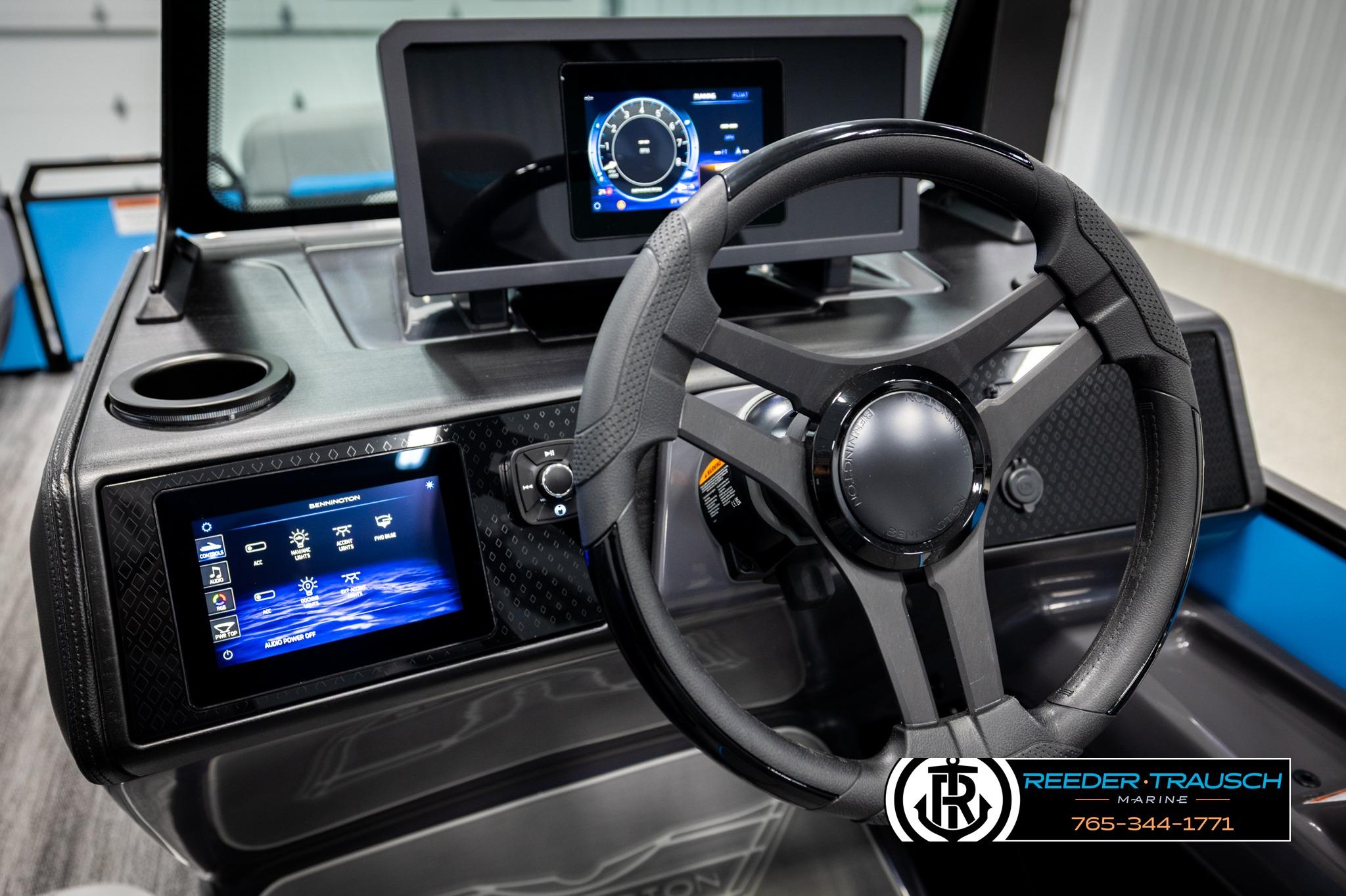 Steering console of 2026 Bennington 22 MSBSE with digital displays and controls.