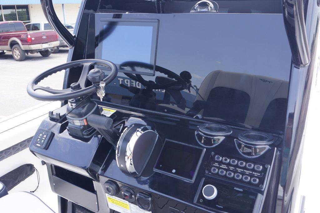 2027 Tidewater 2500 Carolina Bay boat dashboard with steering wheel and electronic controls.