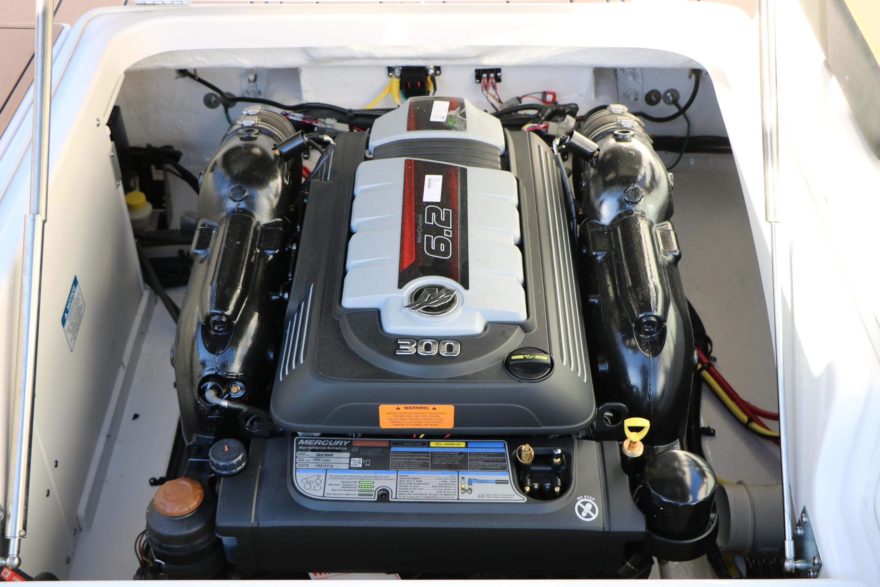 Engine compartment of 2026 Chaparral 247 SSX boat, featuring a powerful Mercury 6.2L engine.