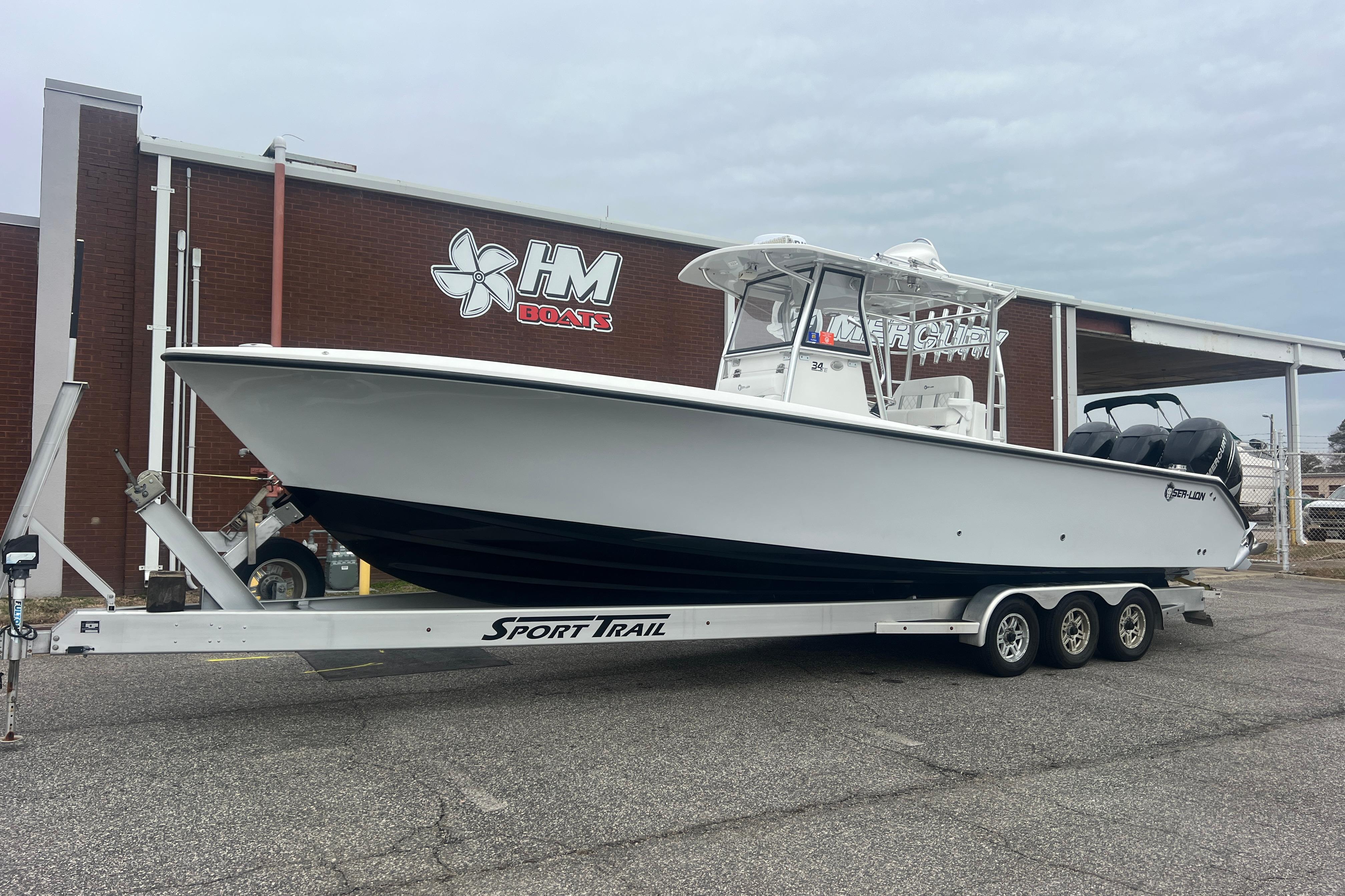2022 Sea-Lion 34 TE boat on trailer outside HM Boats building.