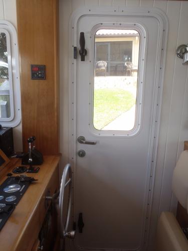 Interior view of 2025 Great Harbour N40 boat with control panel and door.