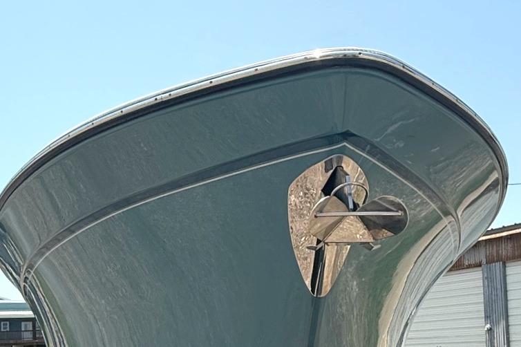 2018 Grady-White Canyon 306 boat bow with anchor, viewed from below against blue sky.