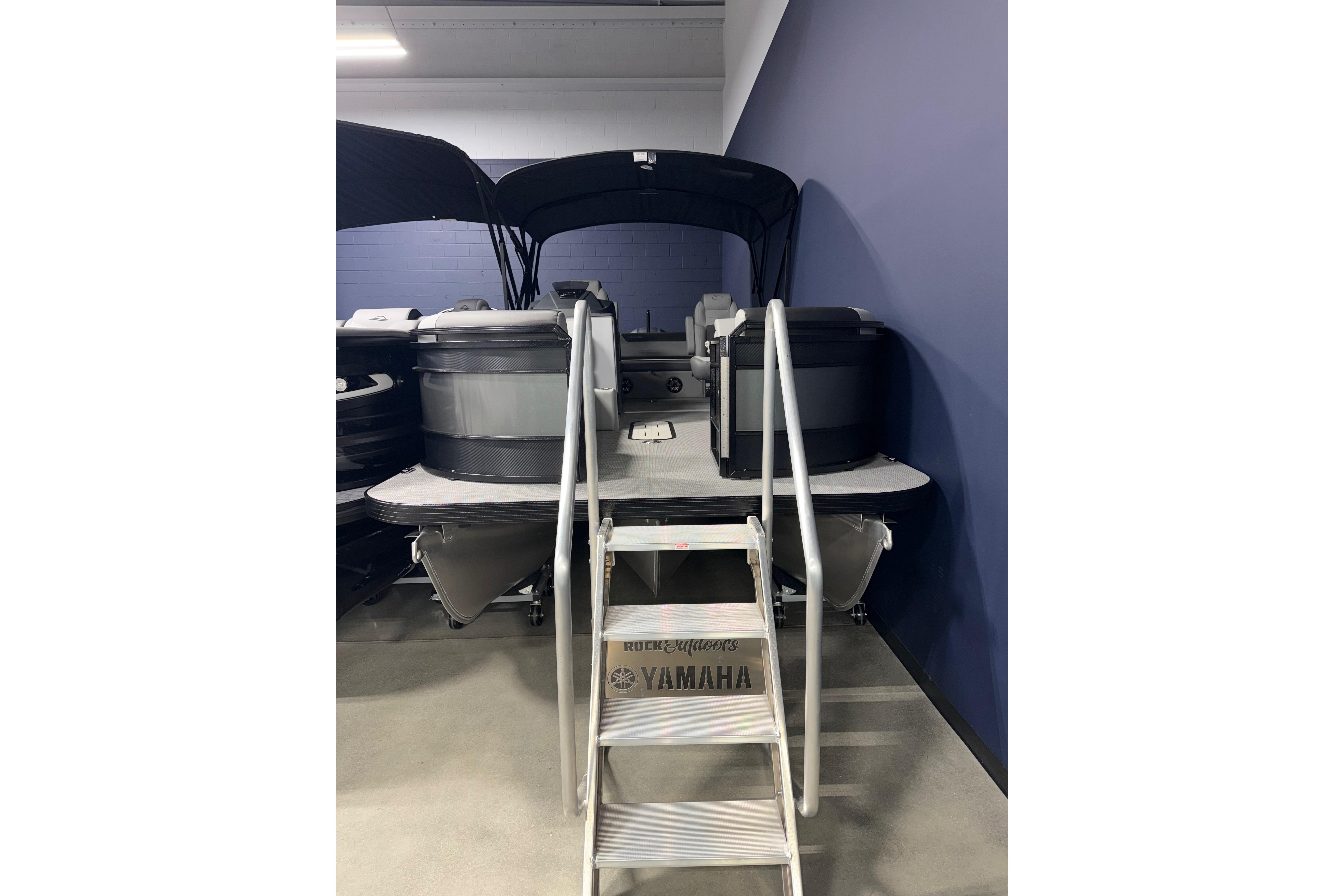 2026 Veranda RELAX VR235VLI pontoon boat with ladder, displayed indoors.