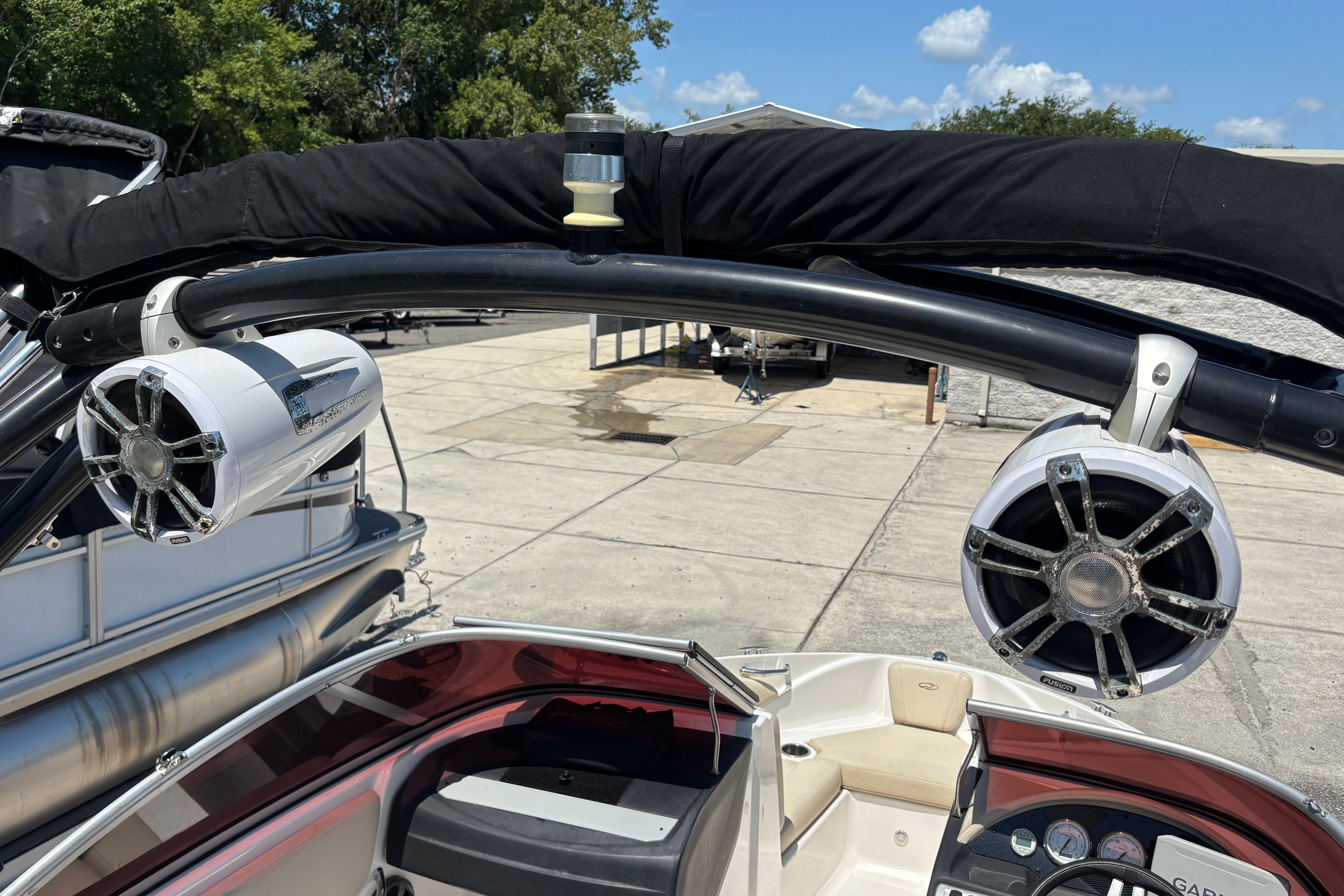2018 Regal 1900 ES Bowrider with mounted speakers and sleek interior design.