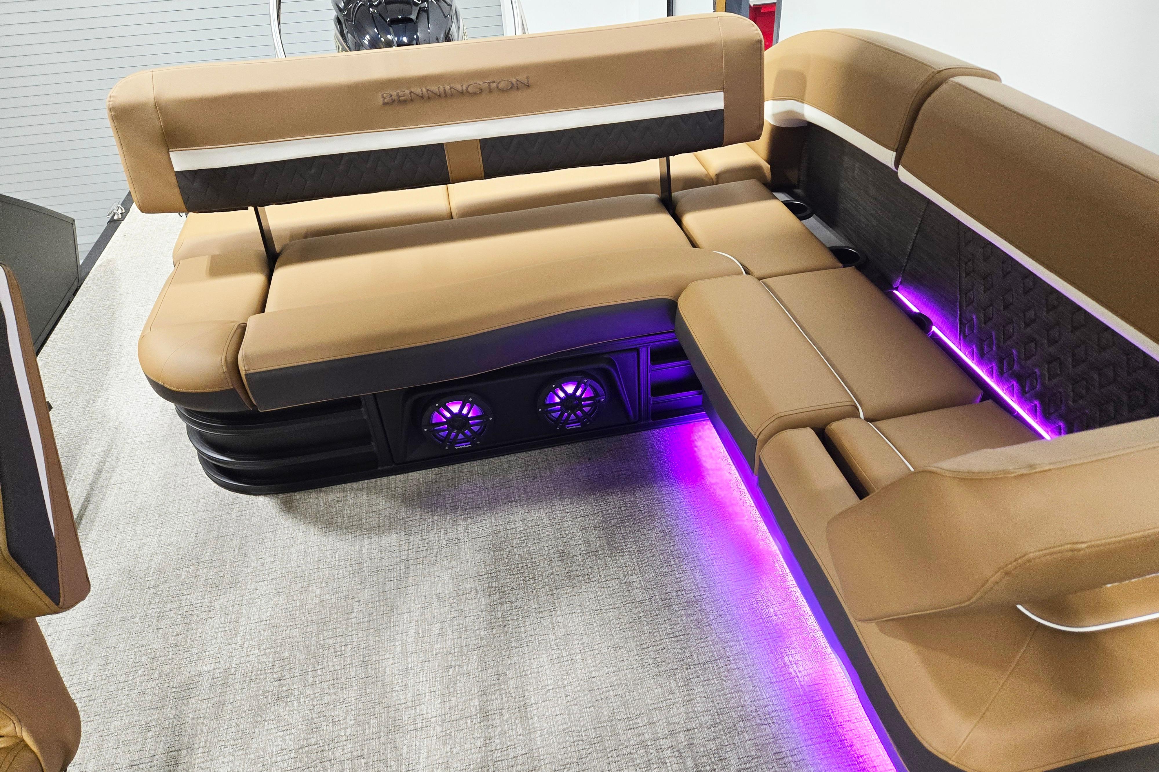 Luxurious seating on 2026 Bennington 22 M Swingback with ambient purple lighting.