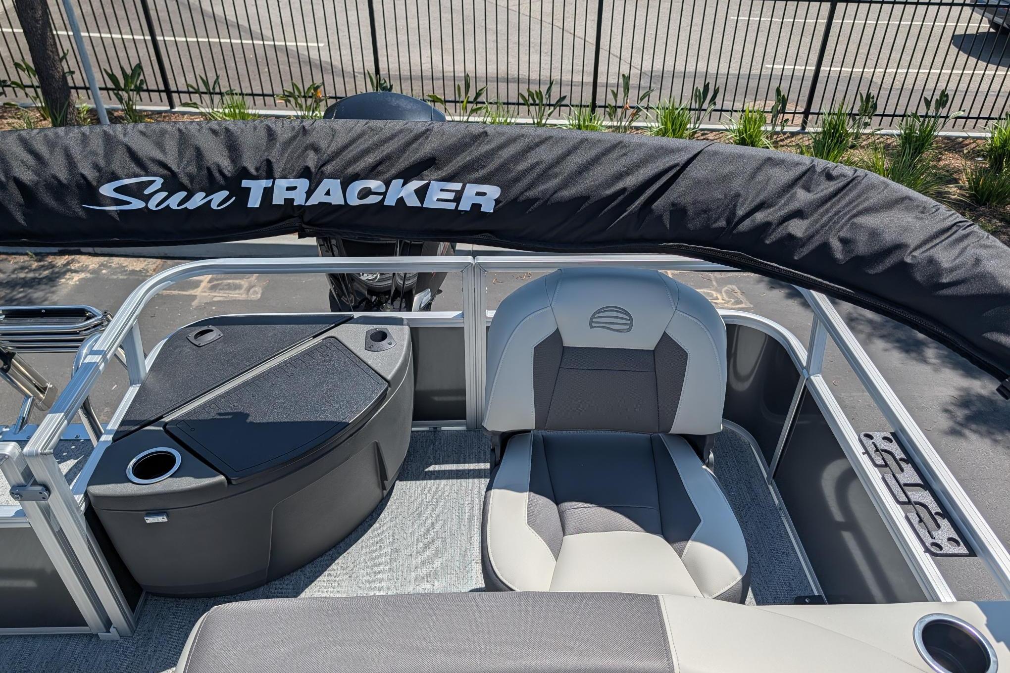 2026 Sun Tracker Bass Buggy 18 DLX pontoon boat interior with seating and storage.