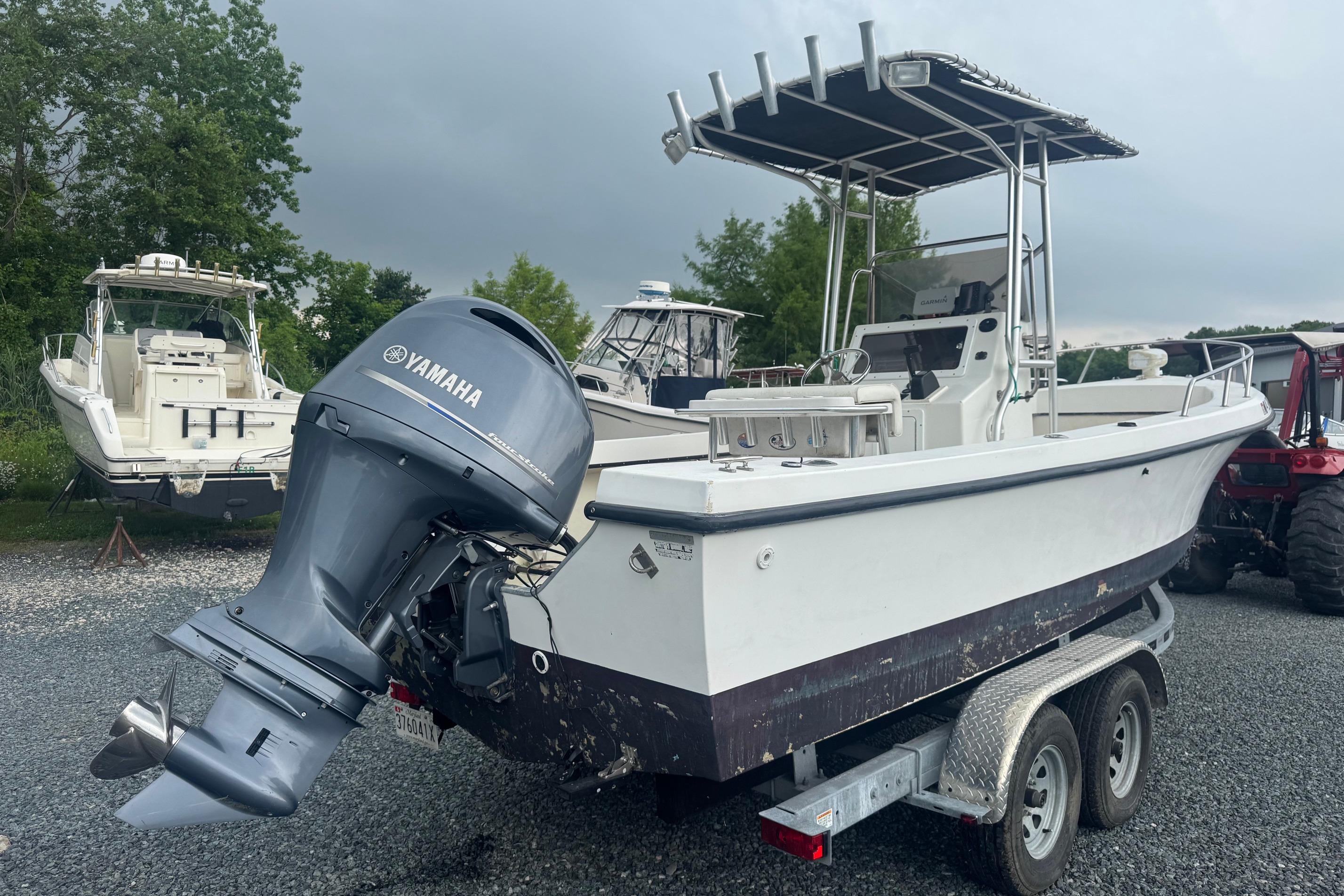 1997 Maycraft 23 boat with Yamaha outboard motor on a trailer.
