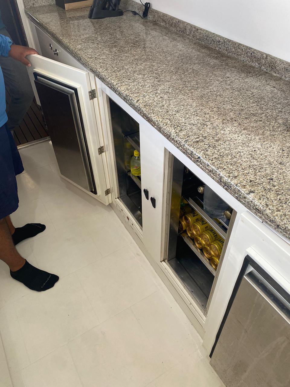 Granite countertop with open cabinets on Azimut 90/100 Jumbo Motoryacht, 1998 model.