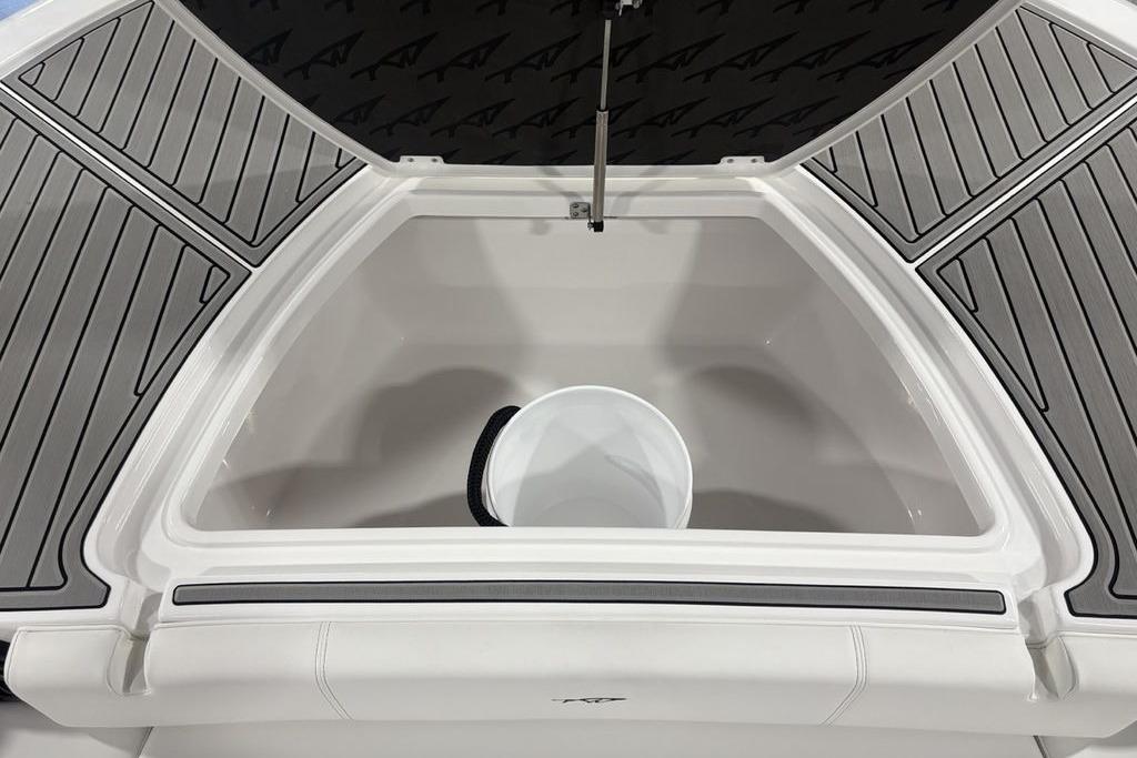 2026 Tidewater 3100 Carolina Bay boat storage compartment with gray non-slip decking.