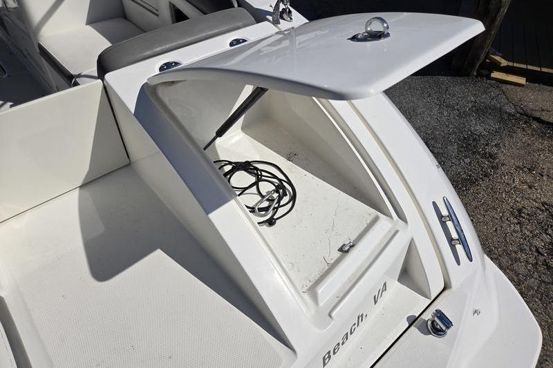 Open storage compartment on a 2011 Sea Ray 300 Sundeck boat.
