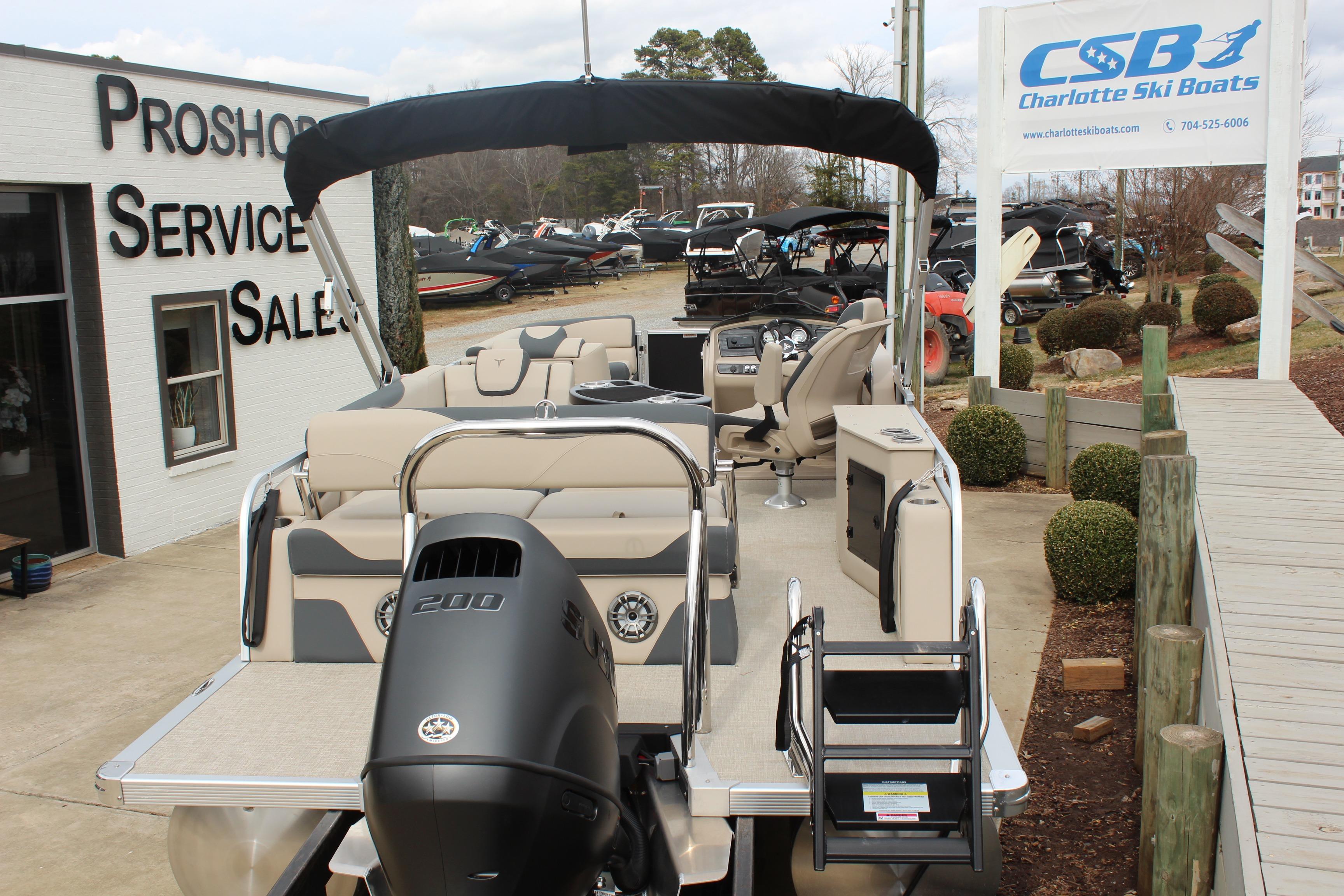 2026 Tahoe Pontoon LTZ at Charlotte Ski Boats dealership, showcasing luxury features and design.