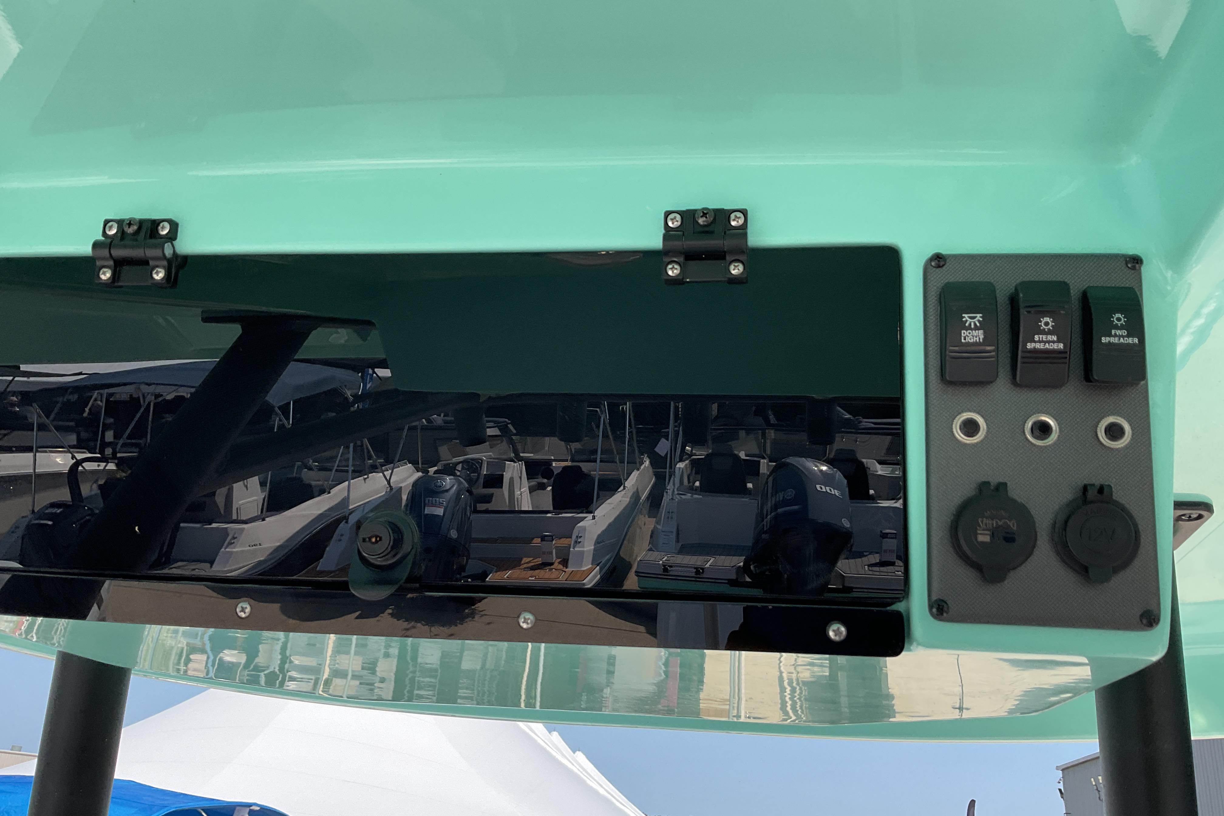 2026 Starcraft SVX 231 OB CC boat dashboard with control switches and ports.