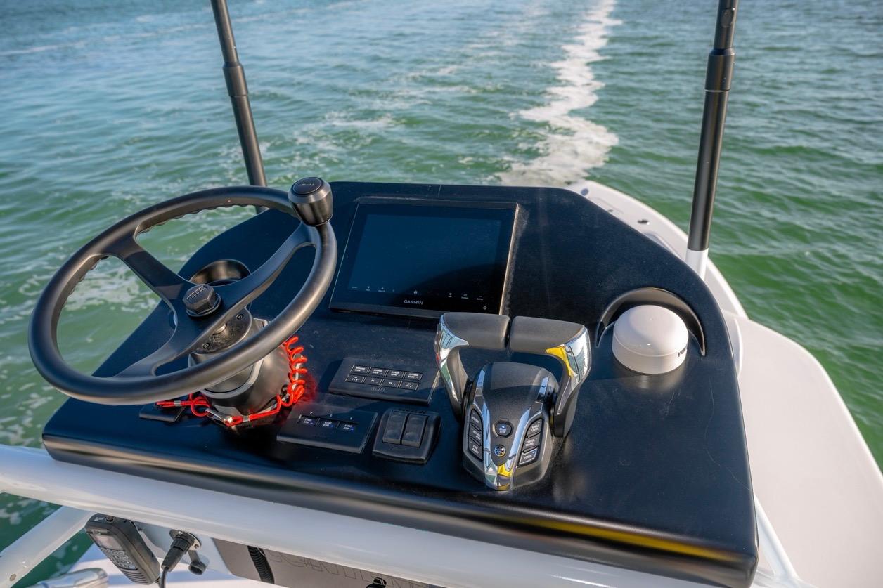 2026 Contender 39 ST boat helm with steering wheel and navigation controls.