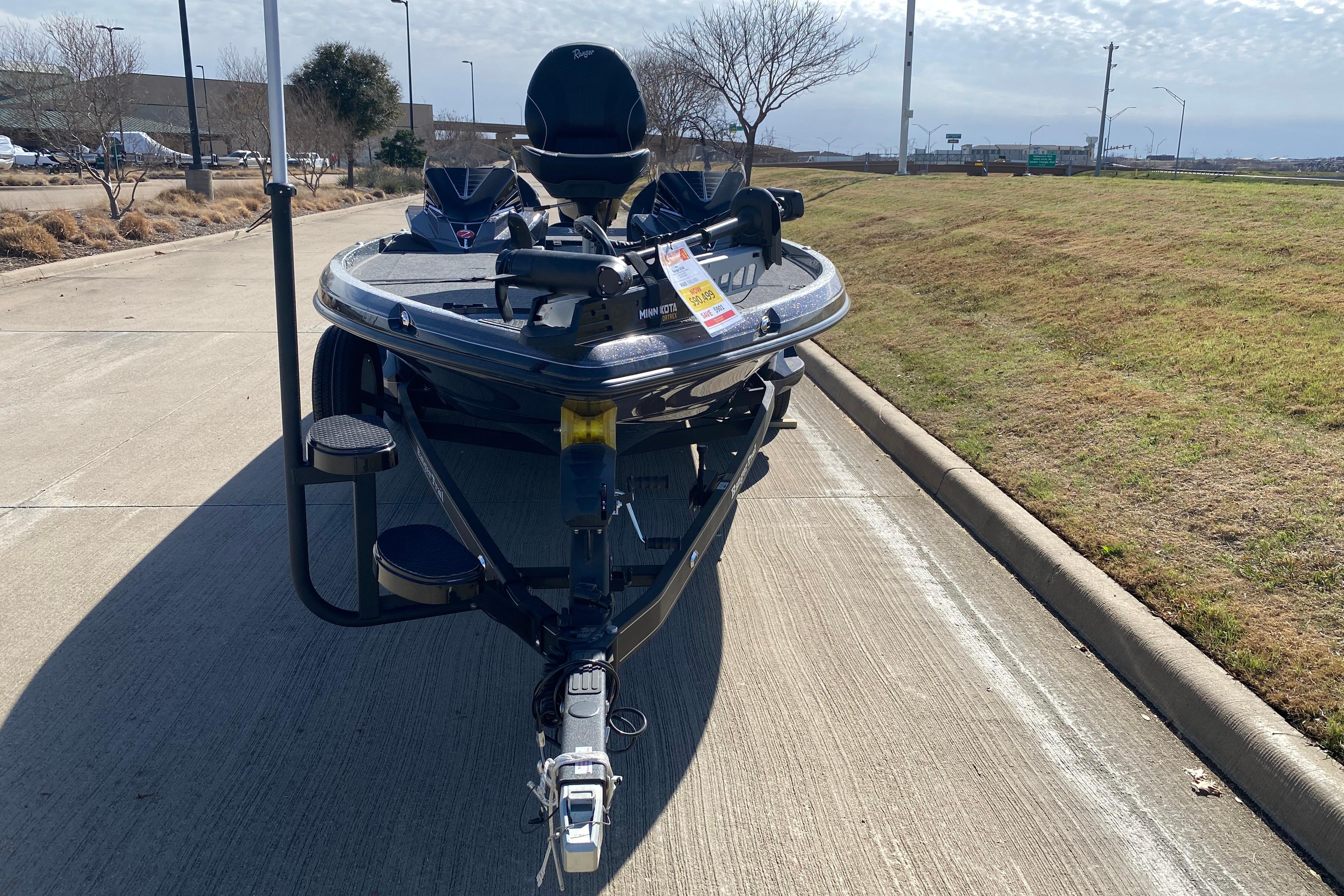 2025 Ranger Z520 boat on a trailer, parked on a sunny roadside.