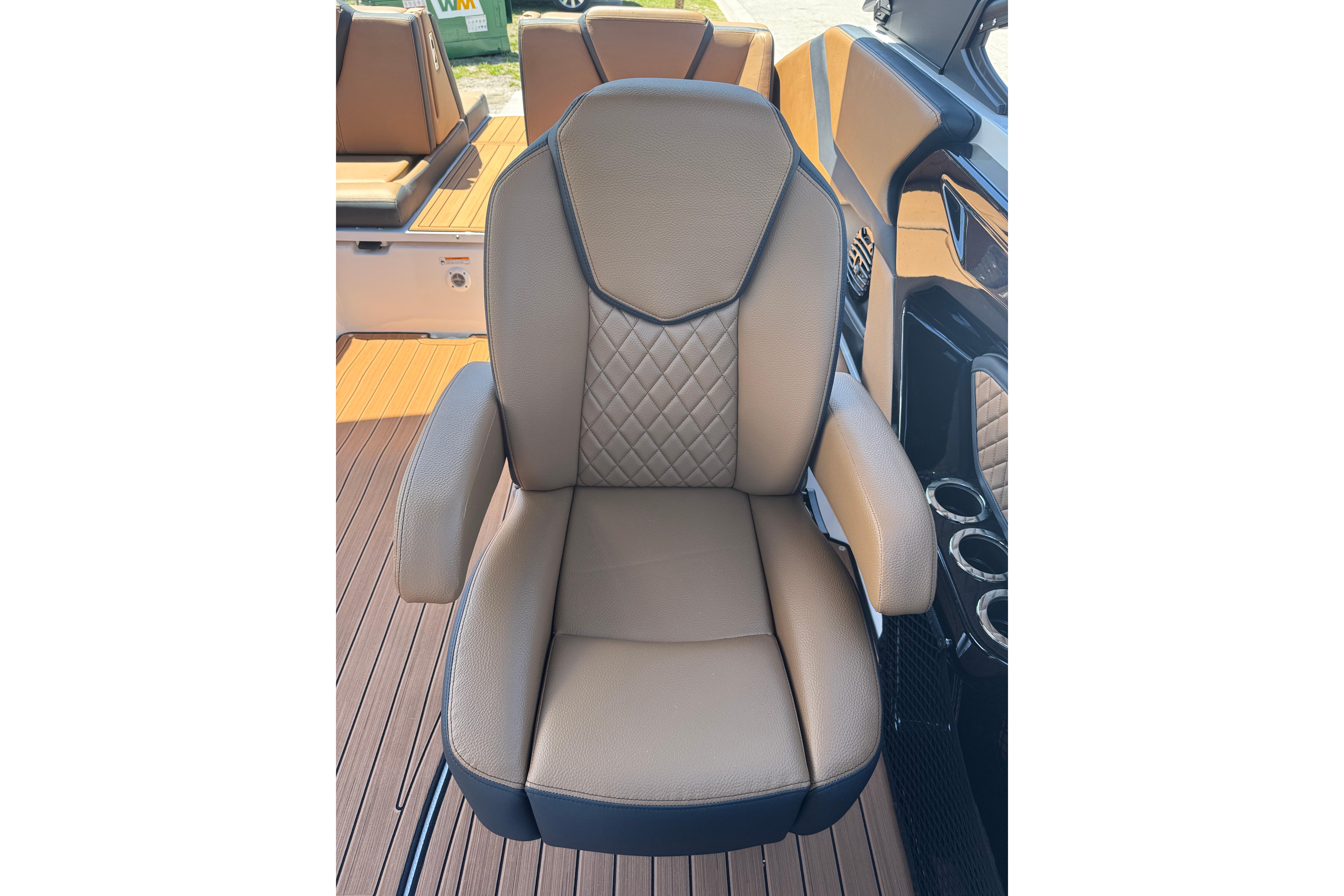 Luxury seating on 2026 Yamaha Boats 252SD, featuring diamond-stitched upholstery and armrests.