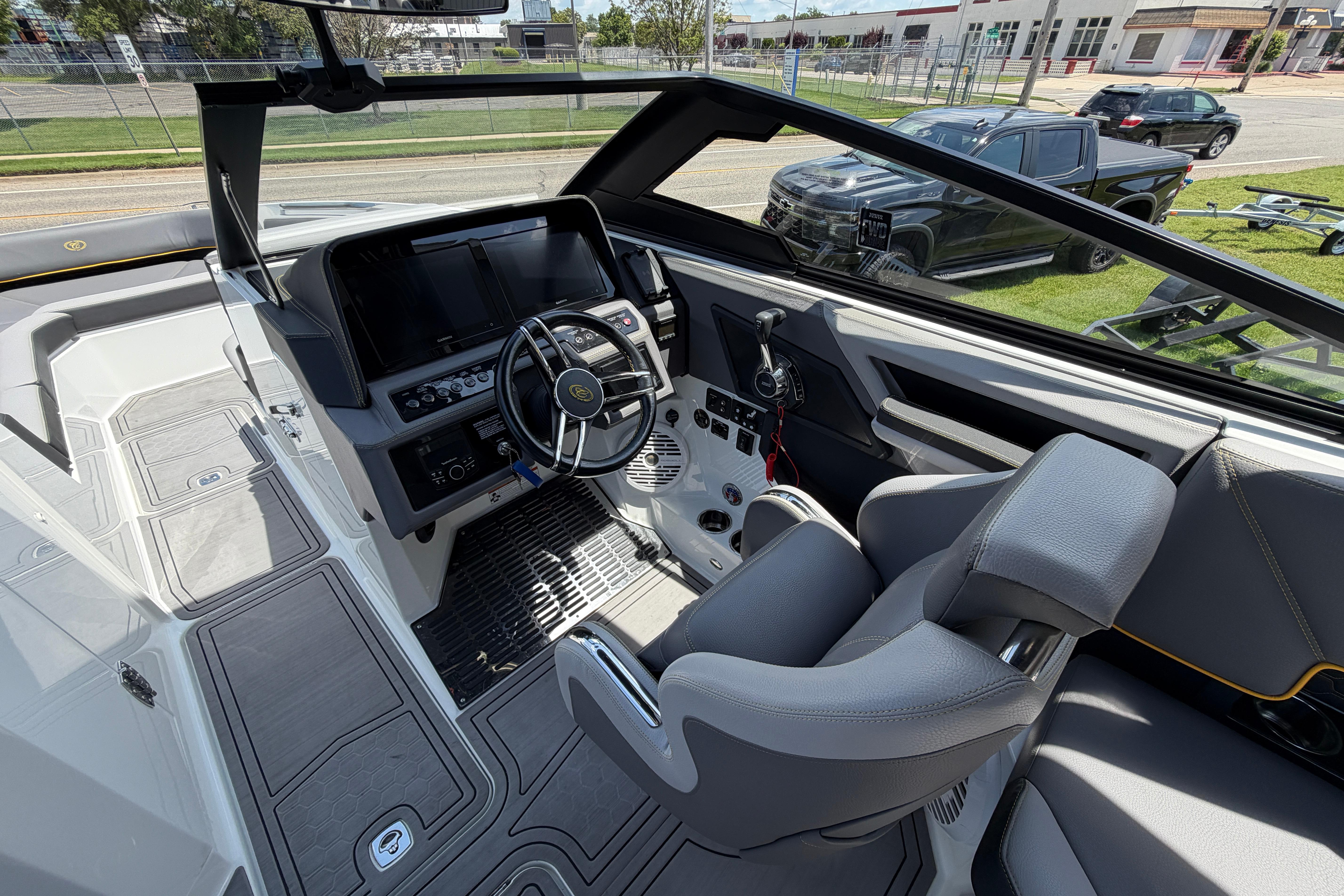 Interior of a 2021 Cobalt R8 Surf boat with modern dashboard and seating.