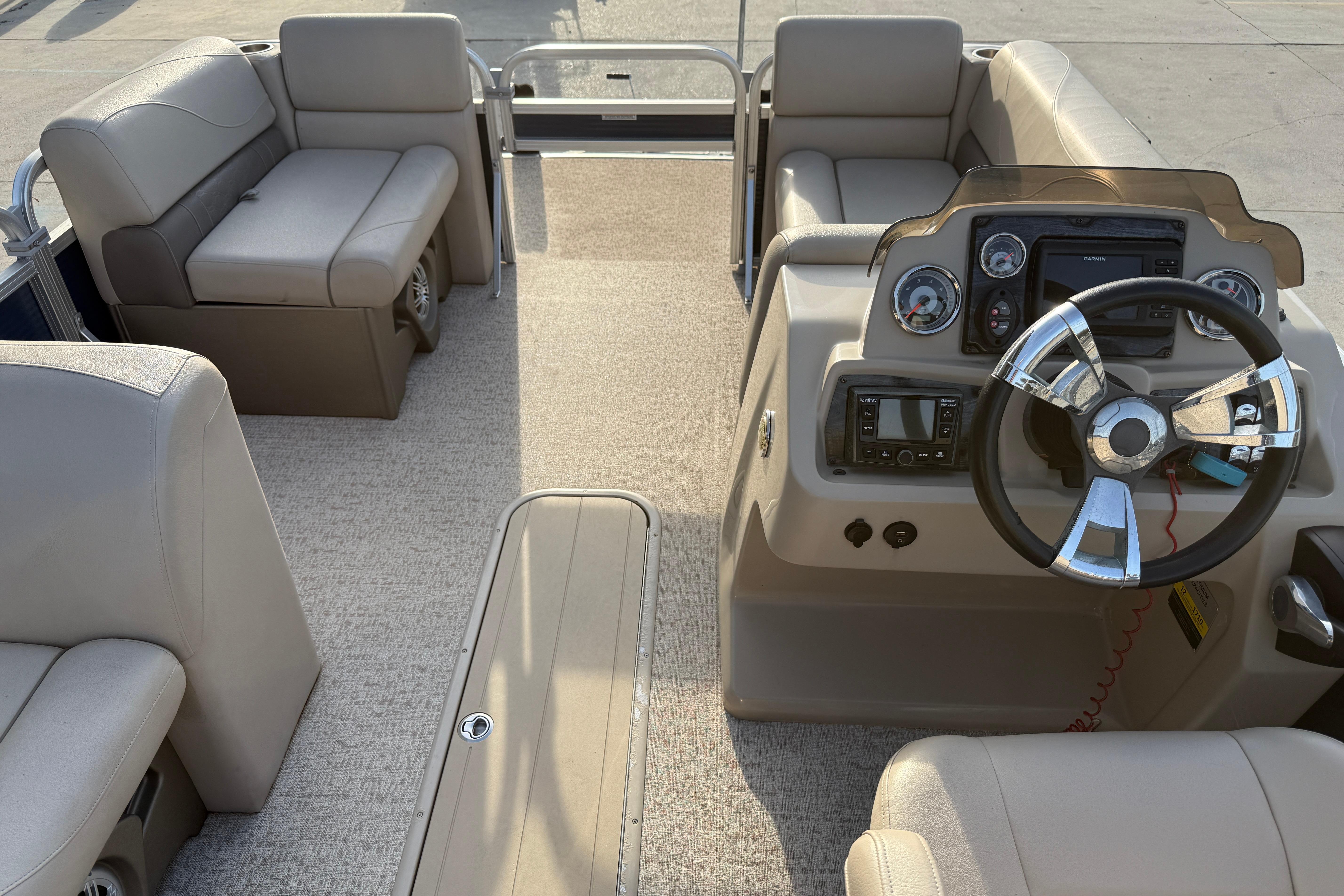 2019 Avalon Venture Fish N Cruise boat interior with steering console and seating.