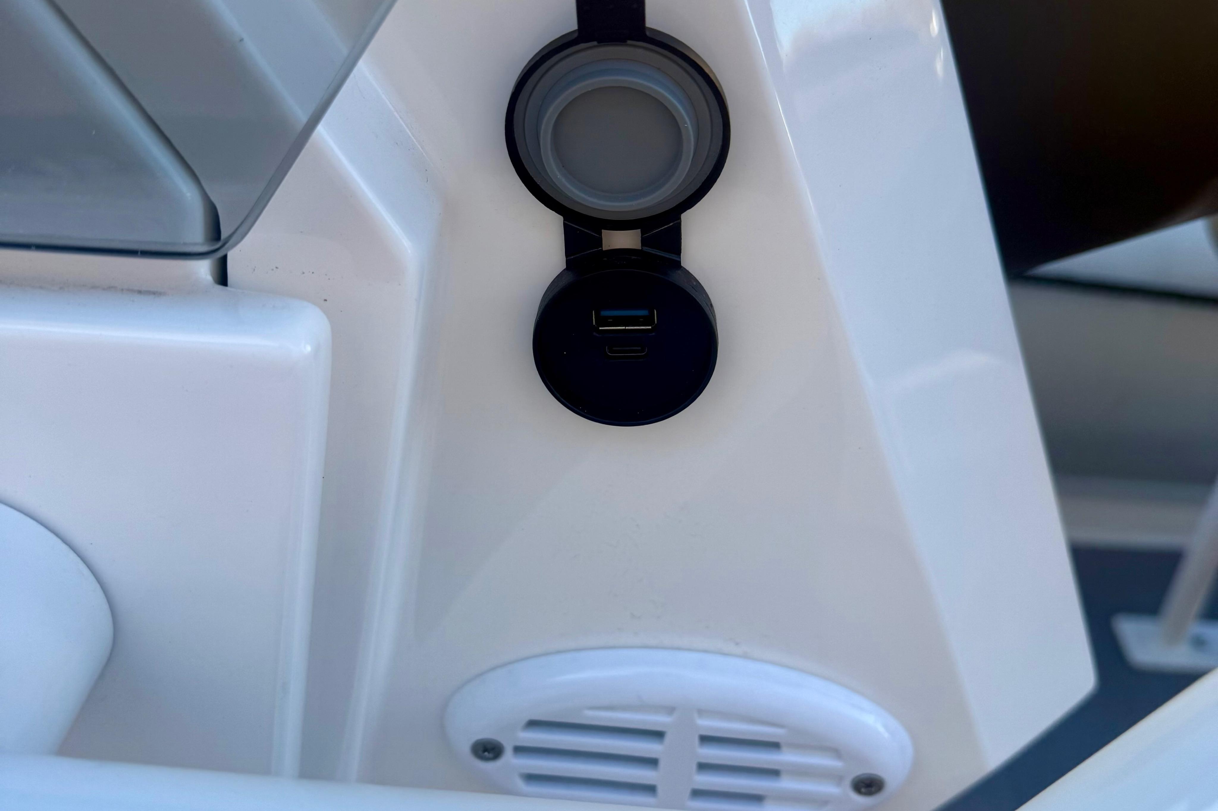 2025 Highfield Patrol 760 boat console with USB port and speaker.