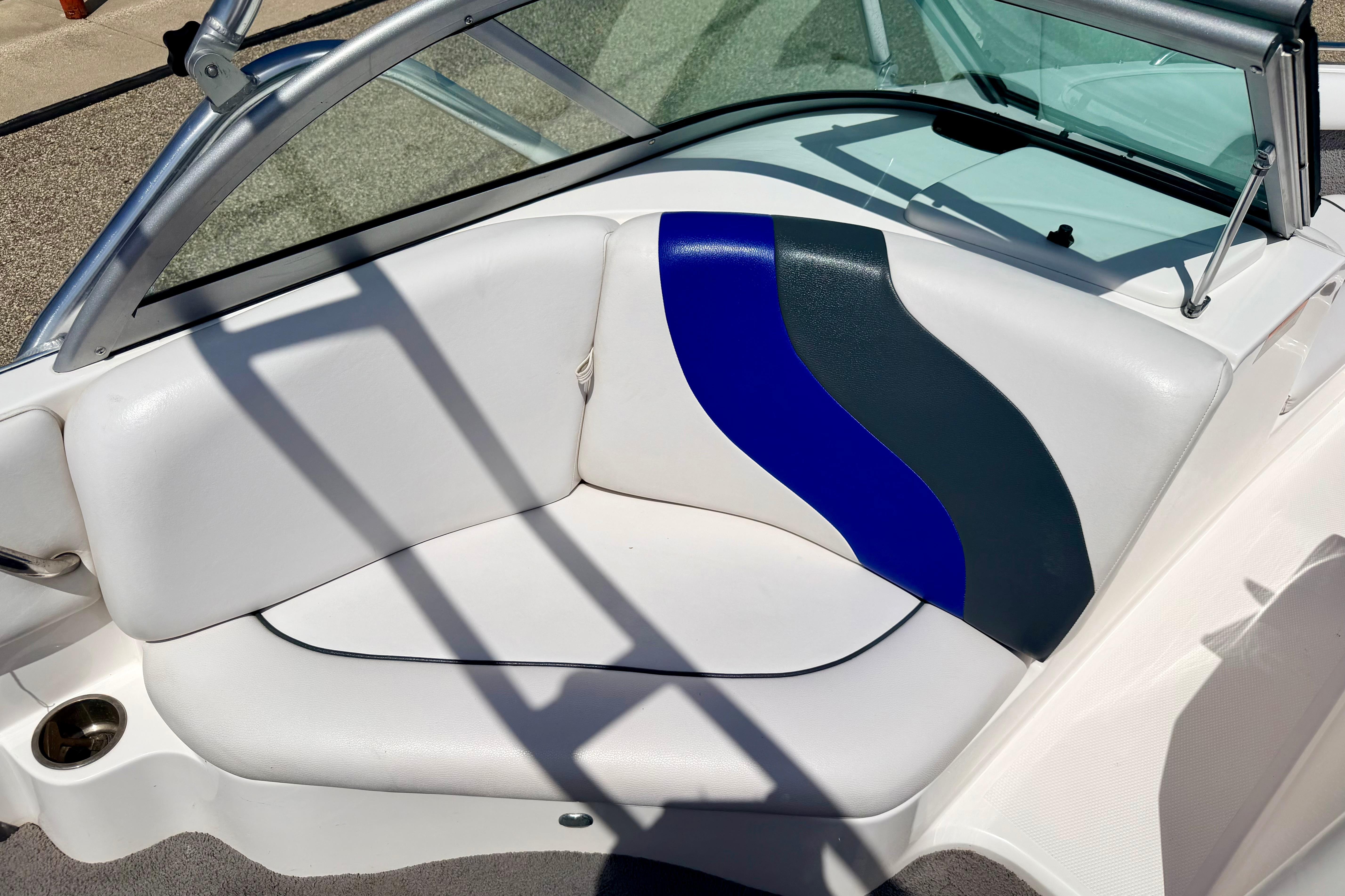 2008 Moomba Outback V boat interior with white and blue seating.