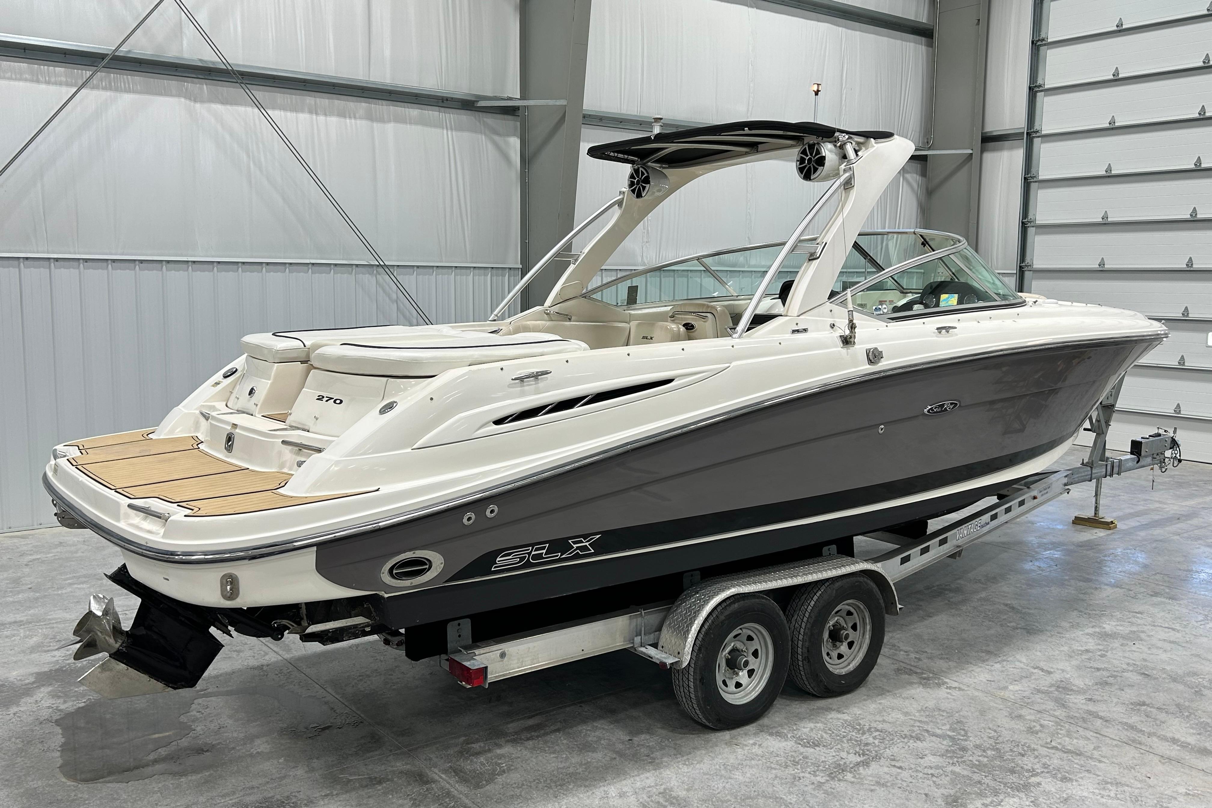 2006 Sea Ray 270 SLX boat on trailer in indoor storage facility.