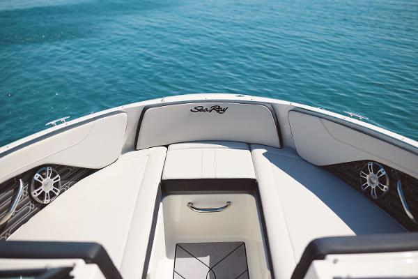 Manufacturer Provided Image: 2025 Sea Ray SPX 210 boat interior with white seating and blue water background.