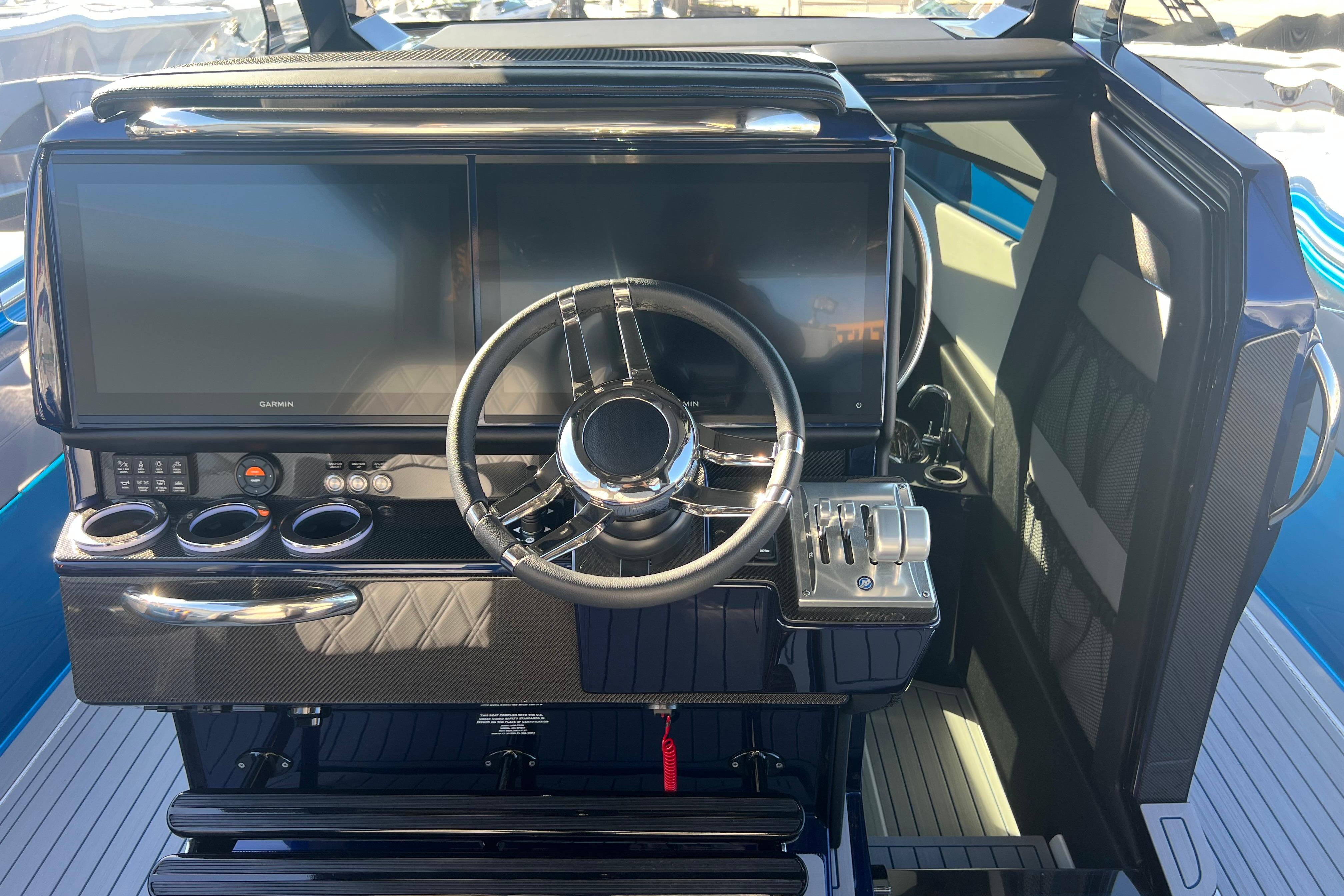 2026 Nor-Tech 450 Sport boat cockpit with modern steering and navigation systems.