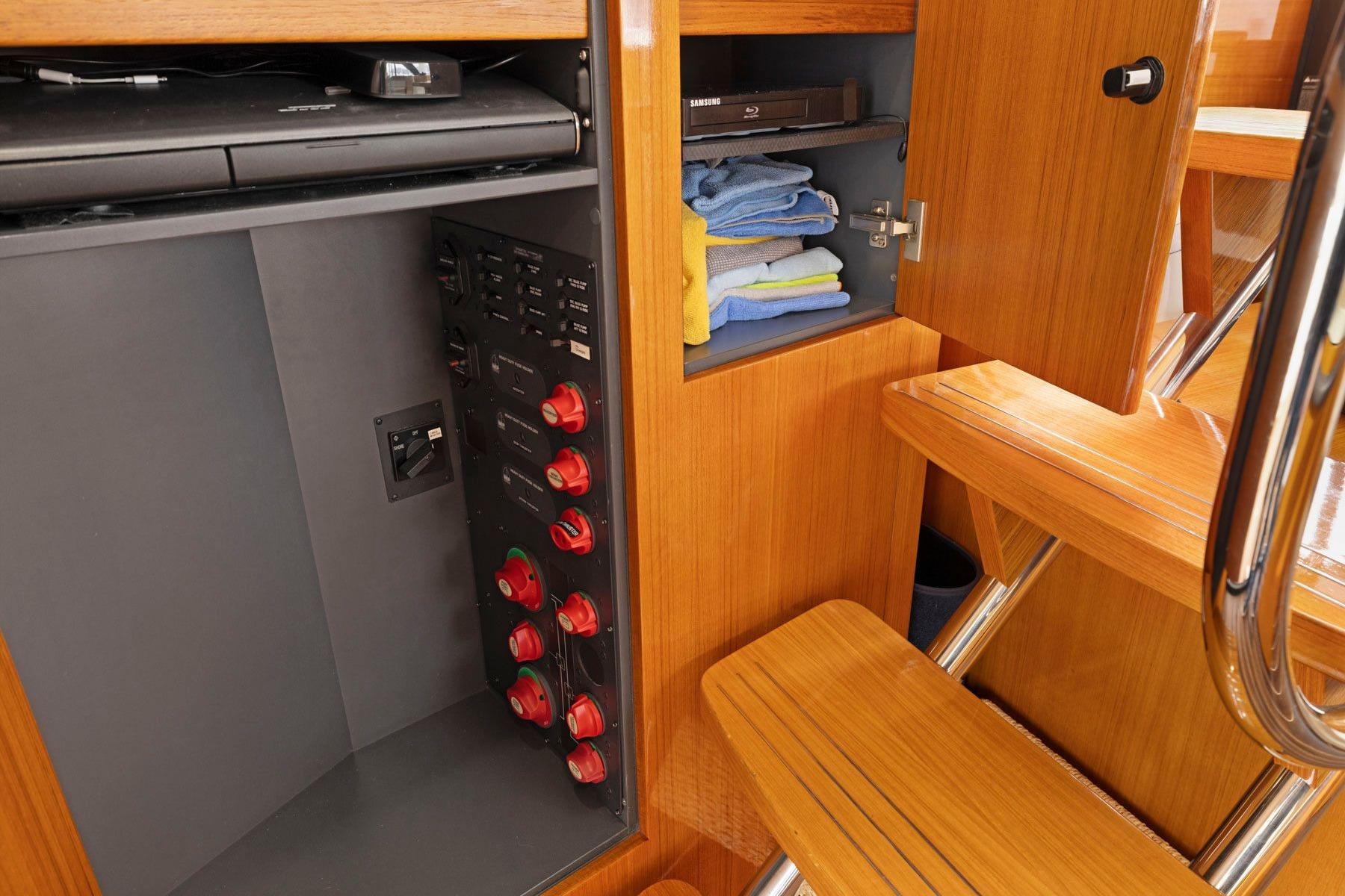 2014 Maritimo M50 yacht interior with wooden cabinetry and storage compartments.