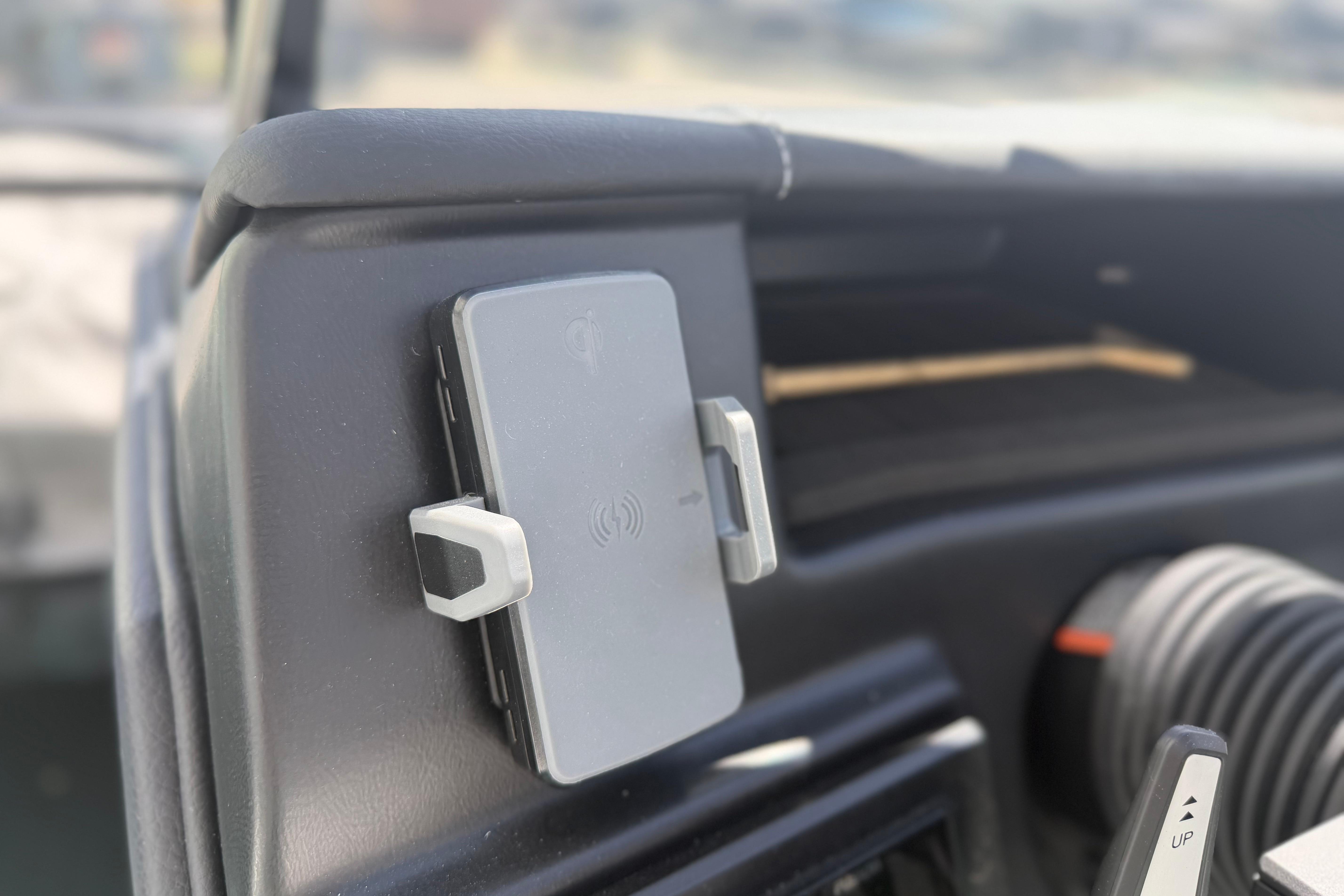 Dashboard of 2025 Moomba Tykon featuring a mounted wireless charging pad.