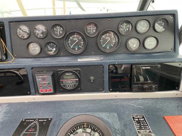 Dashboard of a 1989 Sea Ray 390 Express Cruiser with gauges and navigation equipment.