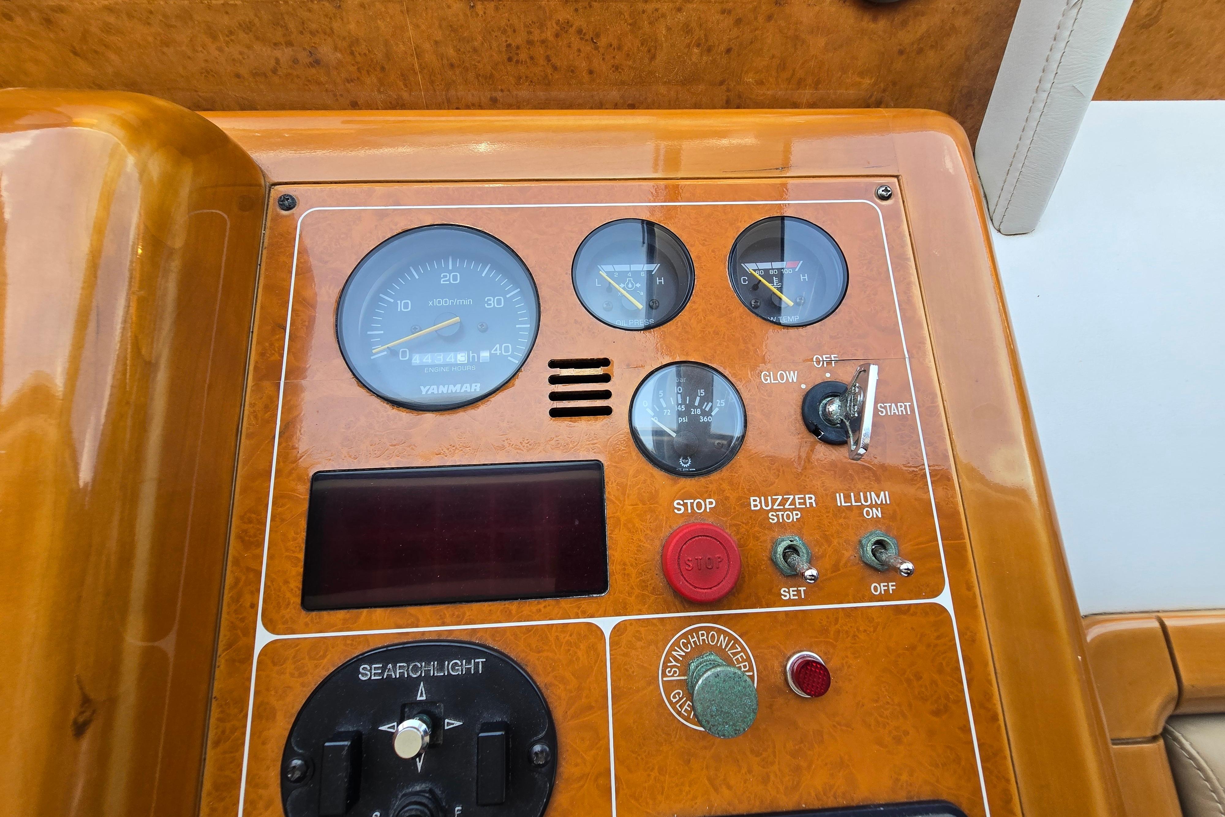 Control panel of a 2004 Grand Harbour 58 yacht with gauges and switches.