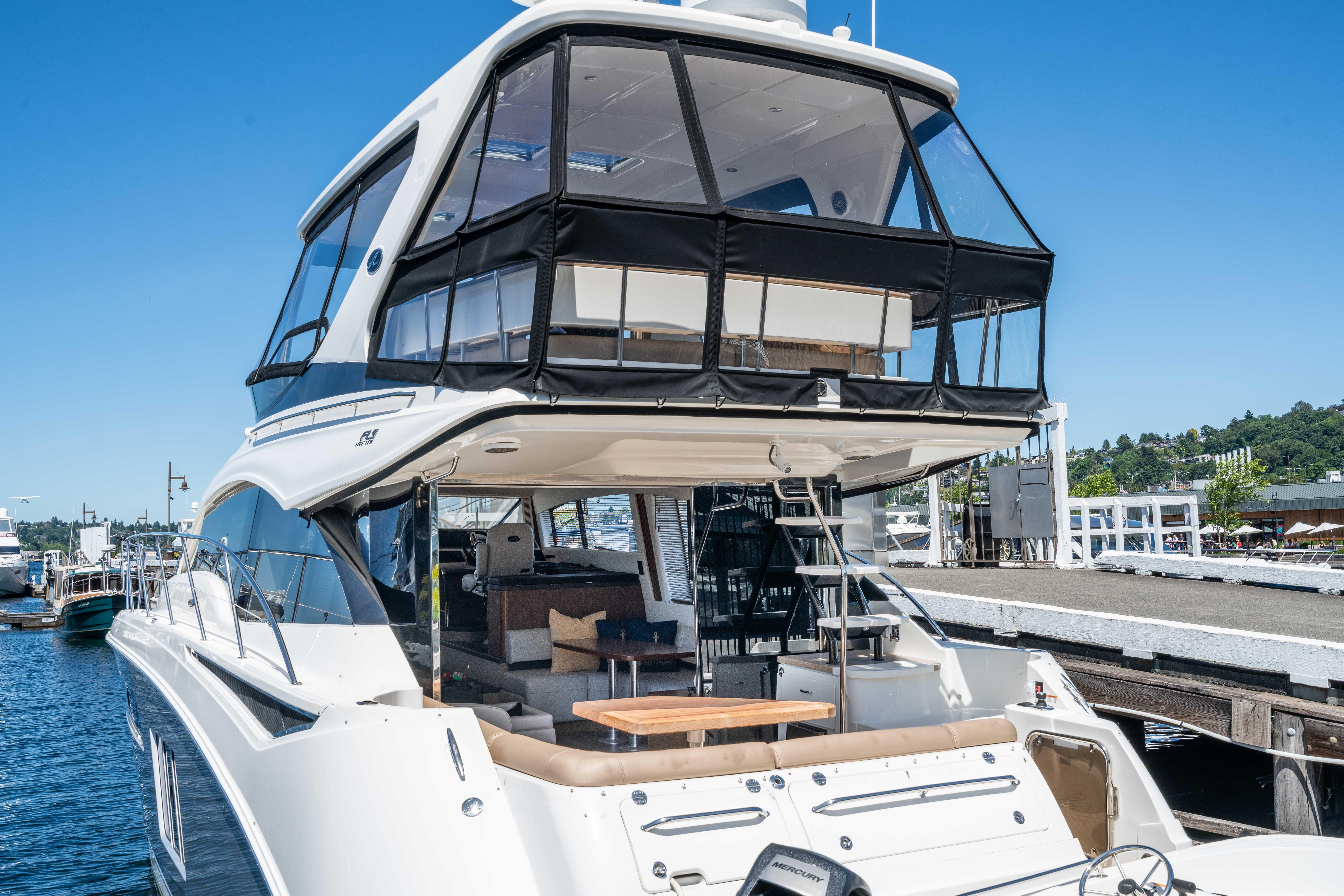 2017 Sea Ray 510 Fly yacht docked, showcasing luxurious design and spacious flybridge.