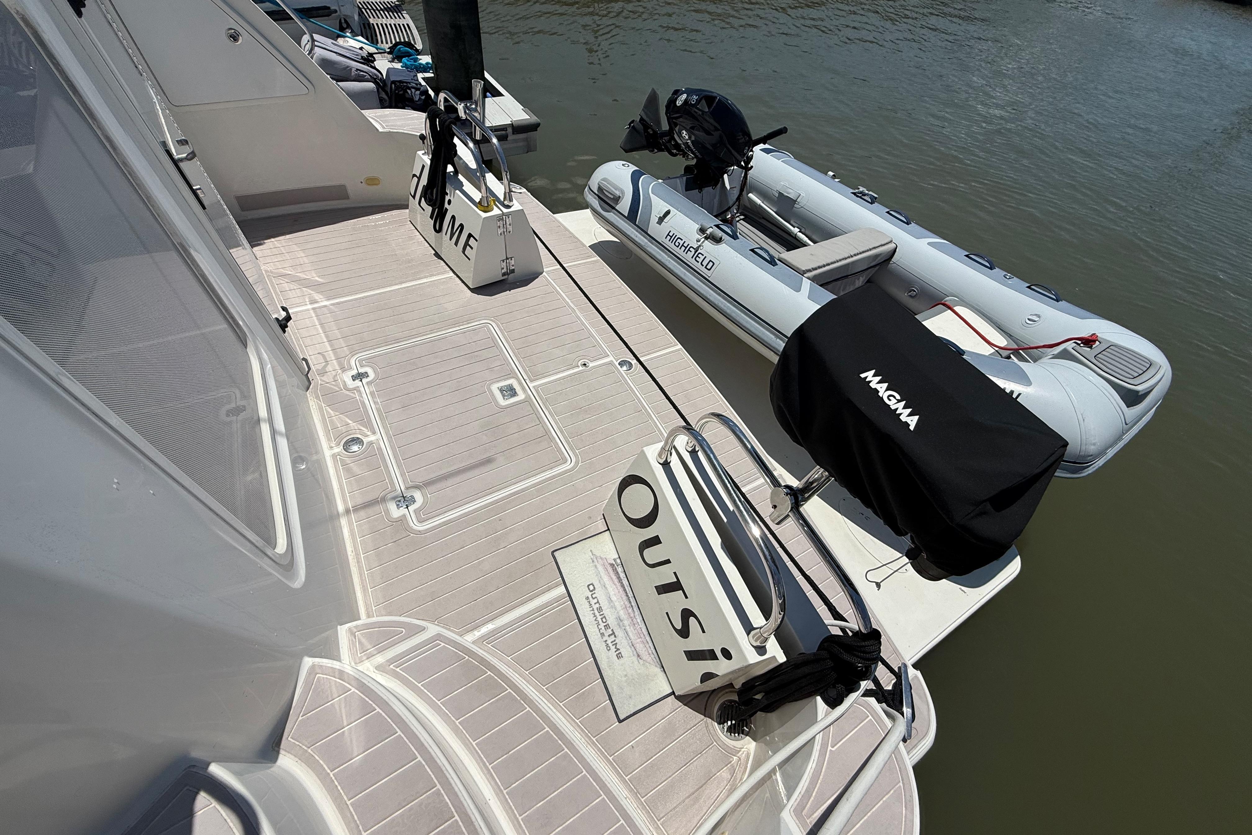 2006 Carver 43 Motor Yacht with dinghy and Magma grill on deck.