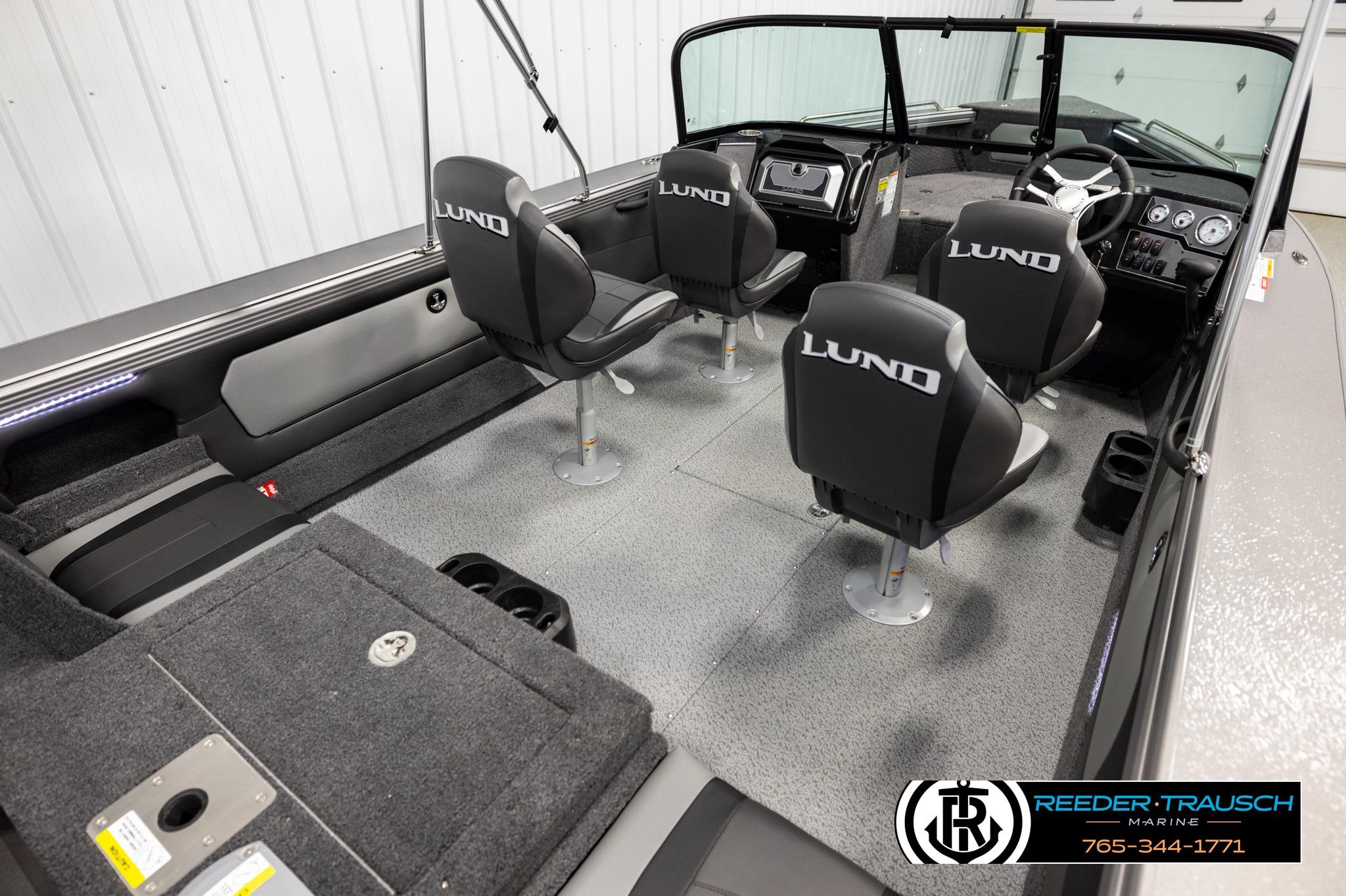 Interior of 2026 Lund 1975 Tyee boat with four seats and modern dashboard.