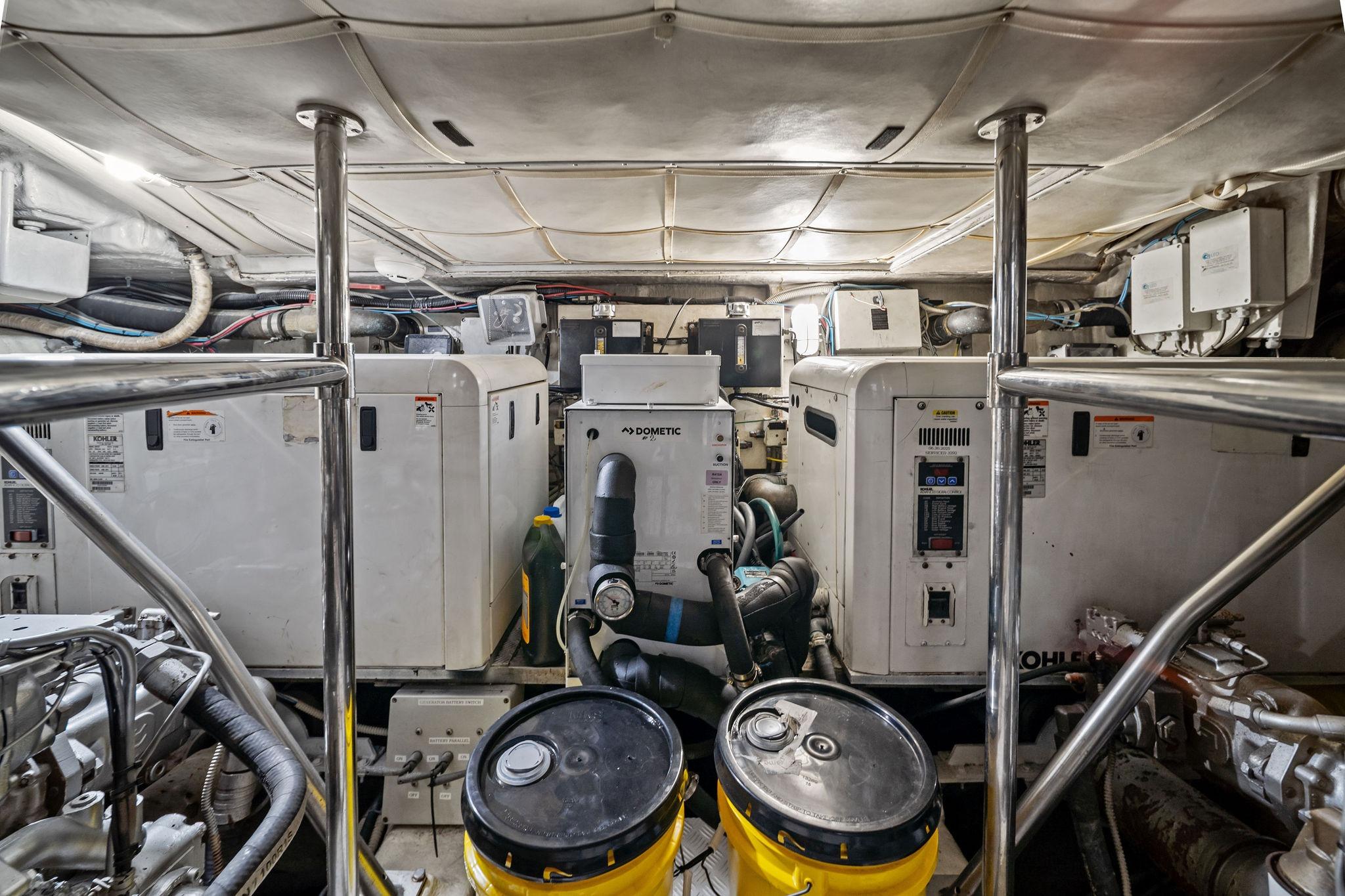 Engine room of a 2013 Pershing 82 yacht, featuring machinery and equipment.