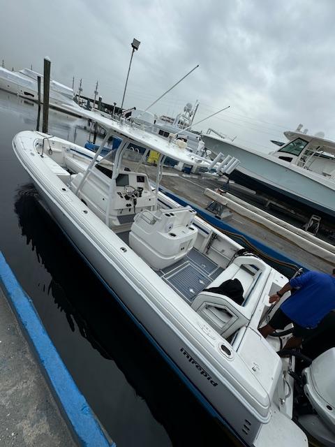 2008 Intrepid Open boat docked at marina on a cloudy day.