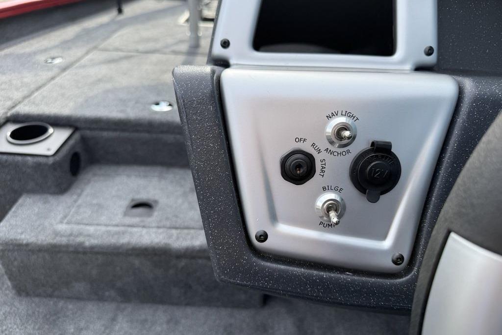 Control panel of 2026 Tracker Pro Team 175 boat with switches and outlets.