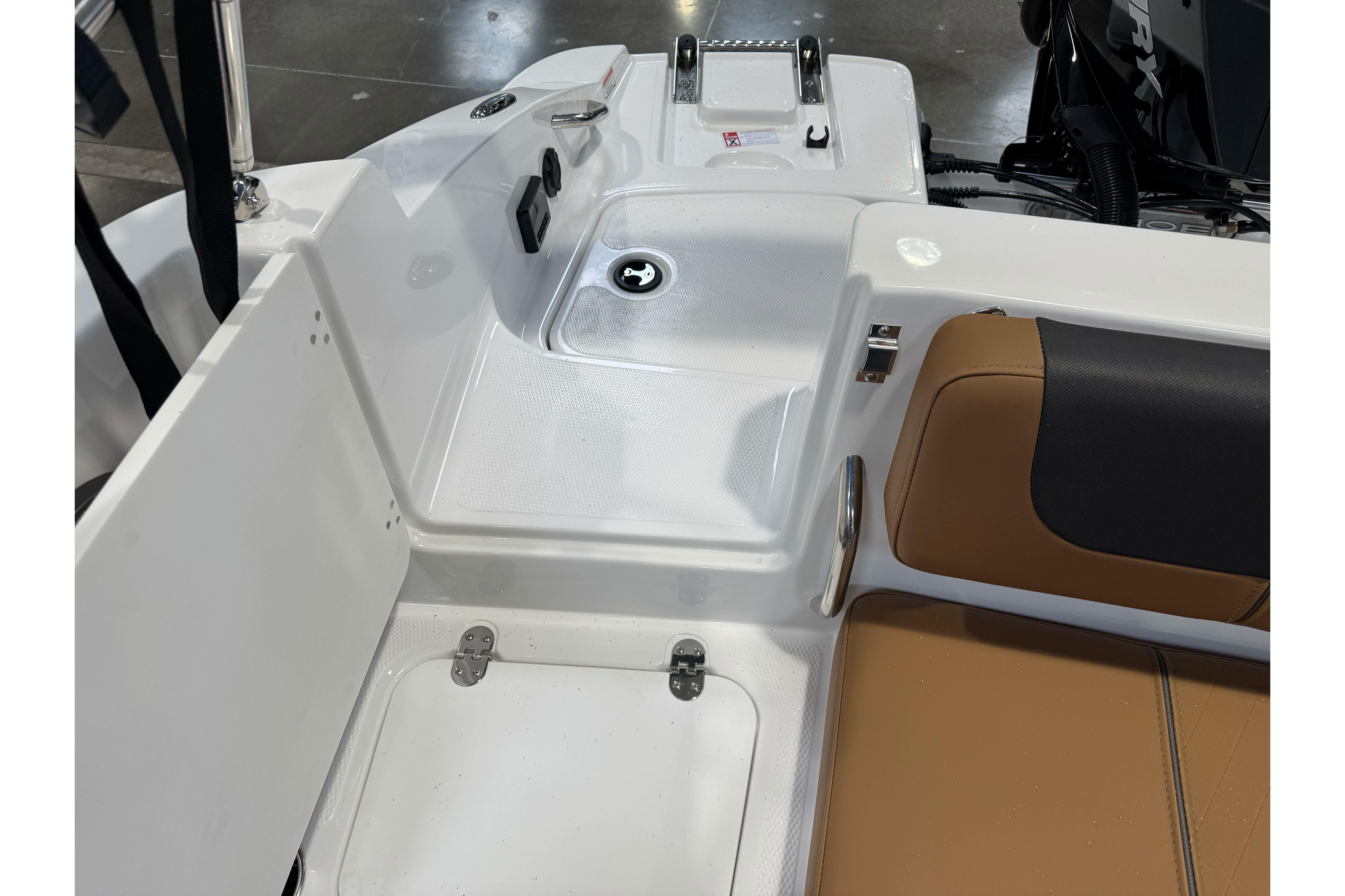2026 Tahoe 2150 boat interior with seating and storage compartments.