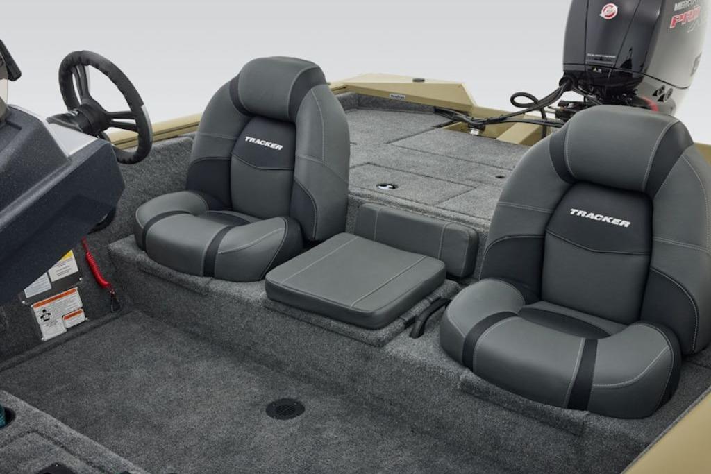 2026 Tracker Pro Team 195 boat interior with gray seating and steering wheel.
