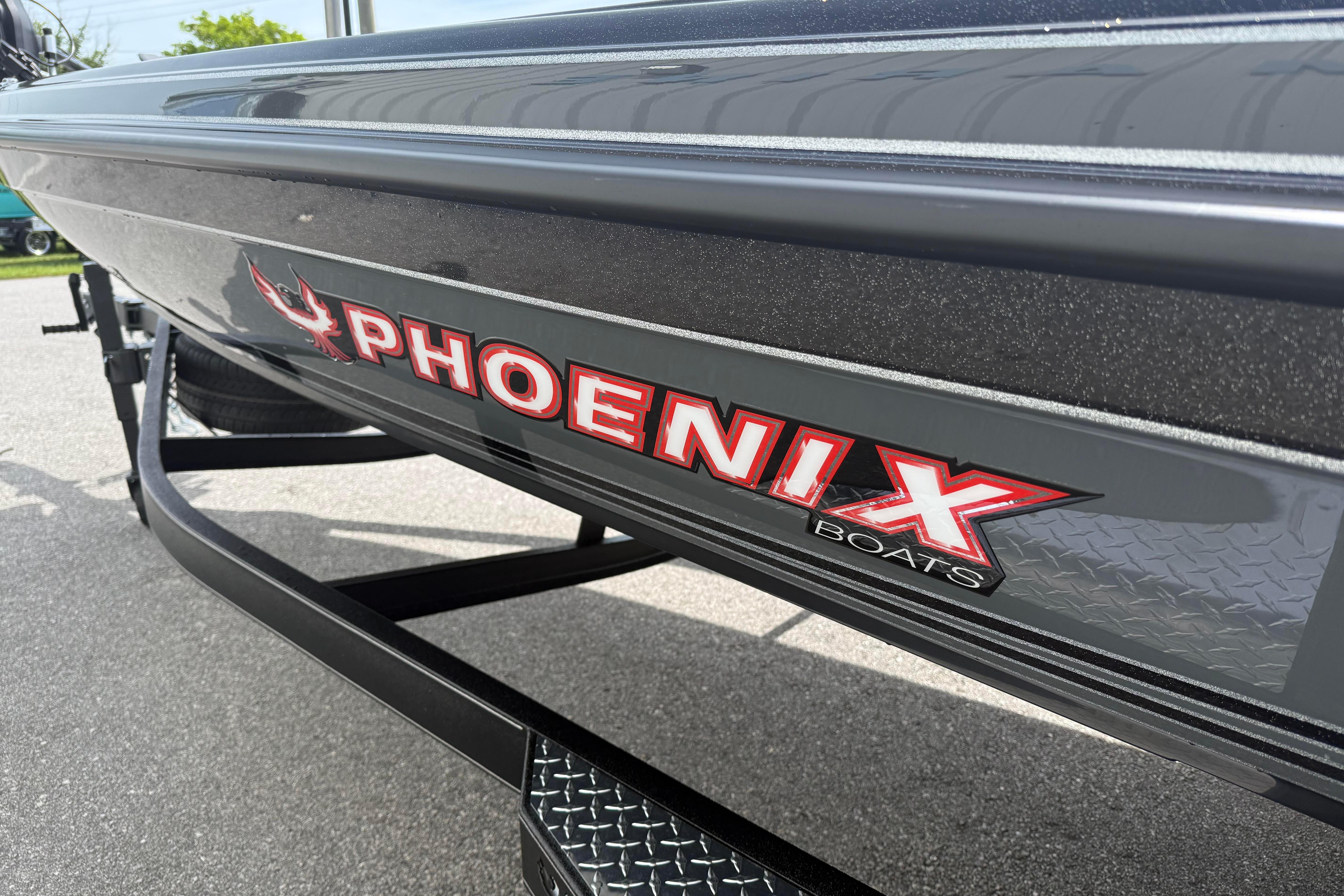 Close-up of 2027 Phoenix 921 Elite X boat logo on a trailer.