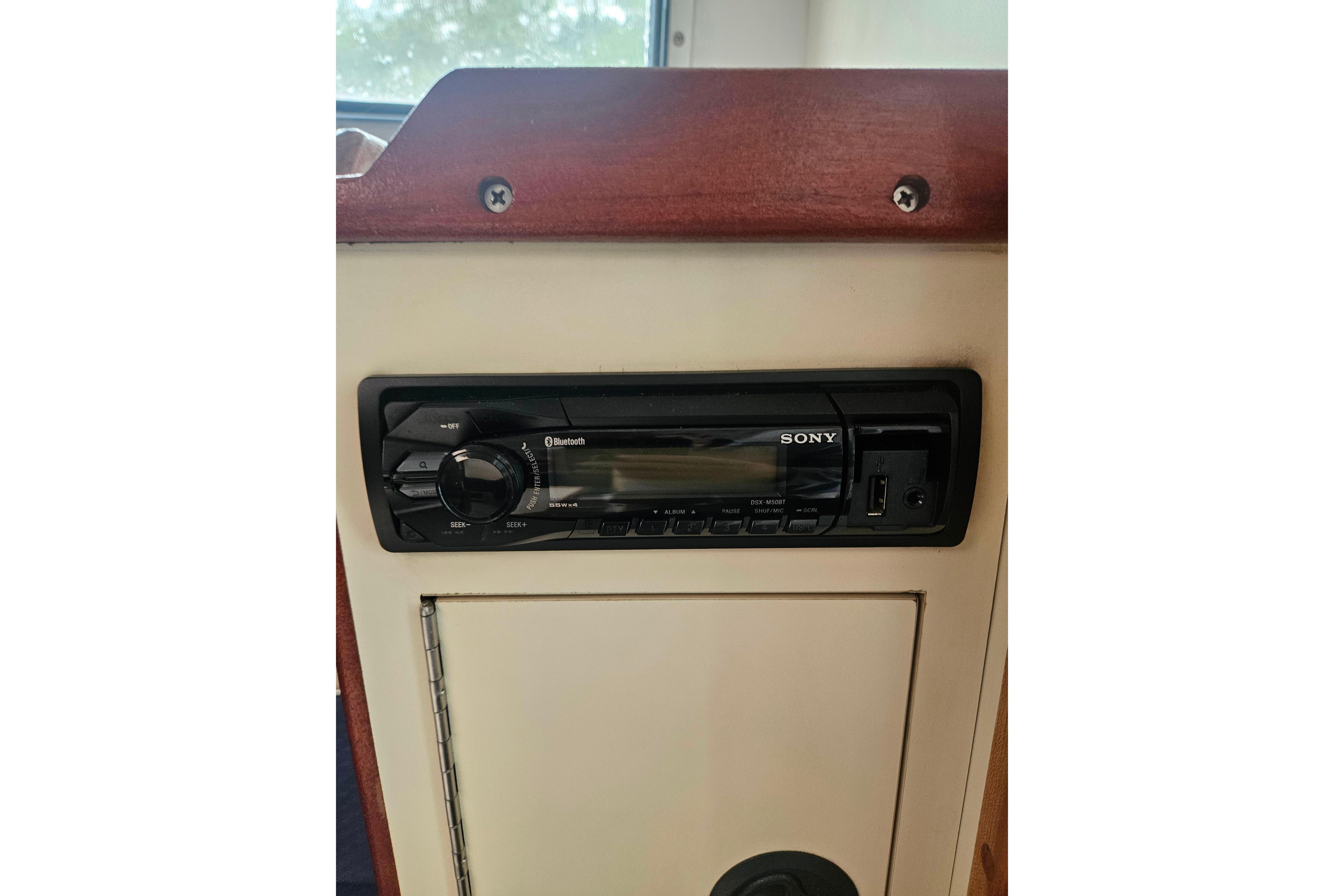 Sony Bluetooth stereo system in a 1999 Albin 28 Tournament Express boat interior.