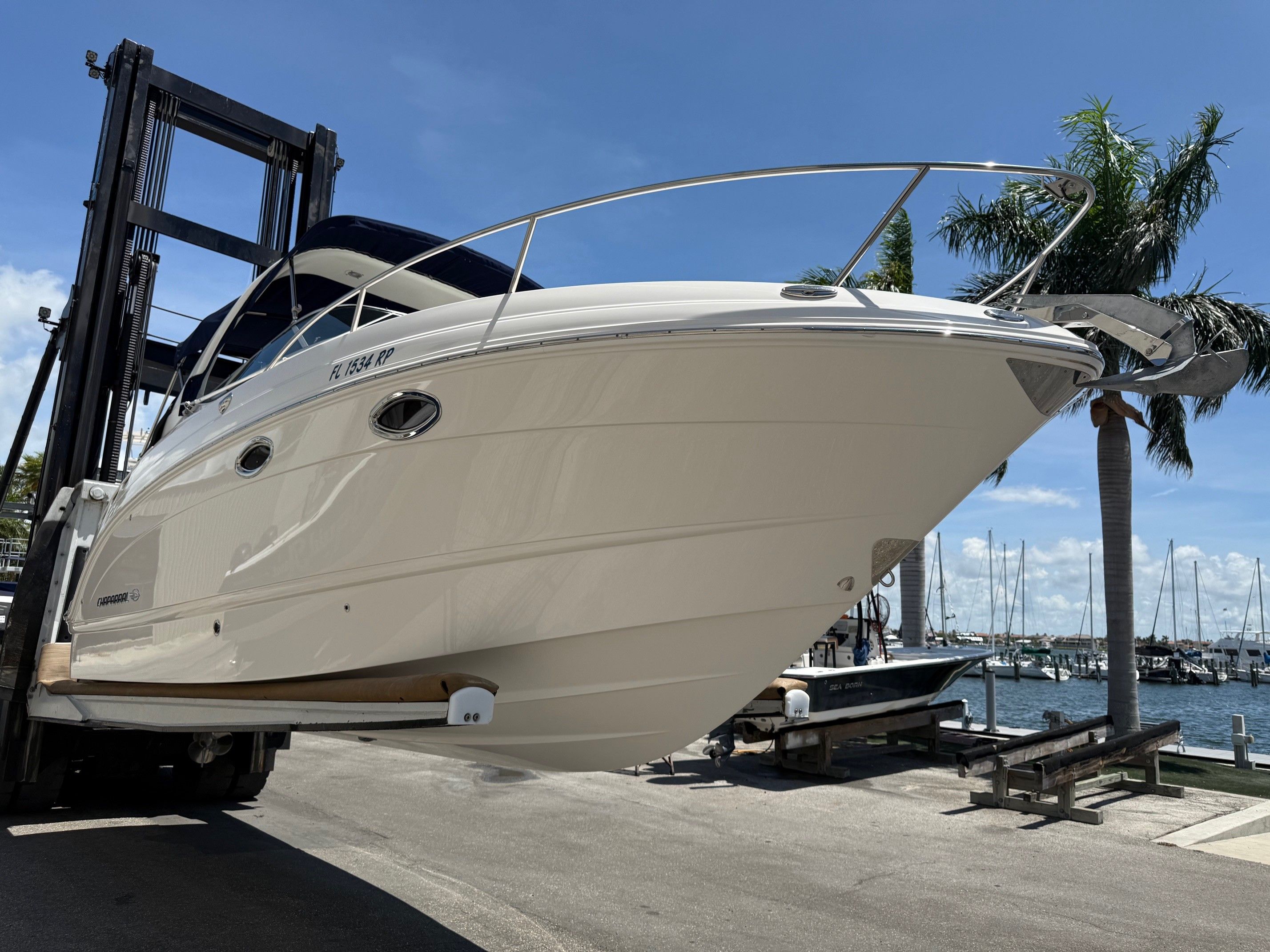 2018 Chaparral 270 Signature on a boat lift at the marina.