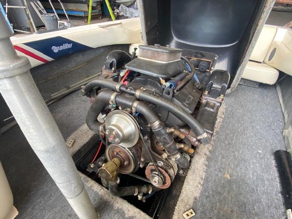 1998 Malibu Response boat engine, exposed view, showcasing mechanical components and interior details.