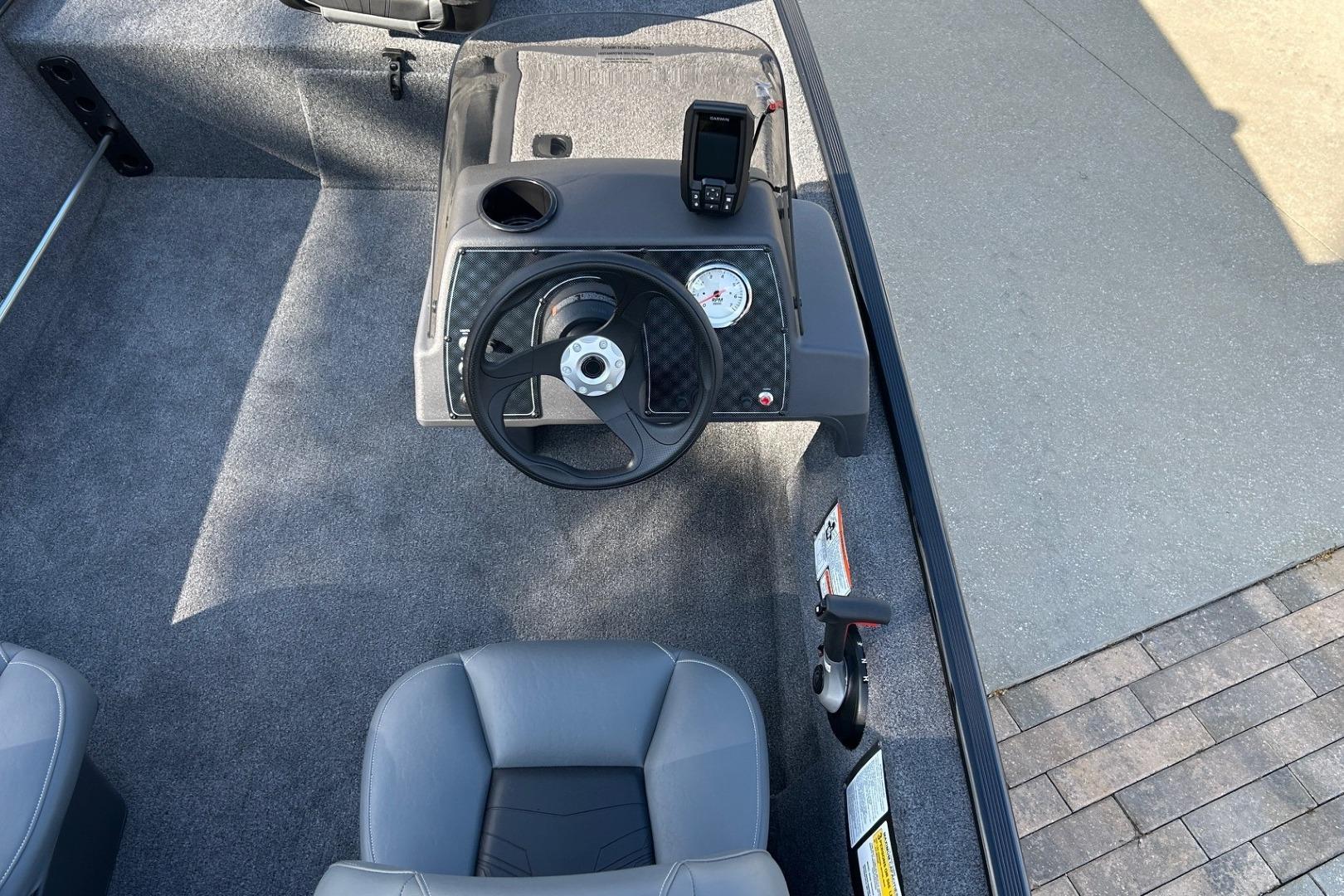 2026 Tracker Bass Tracker Classic XL boat interior with steering wheel and dashboard.