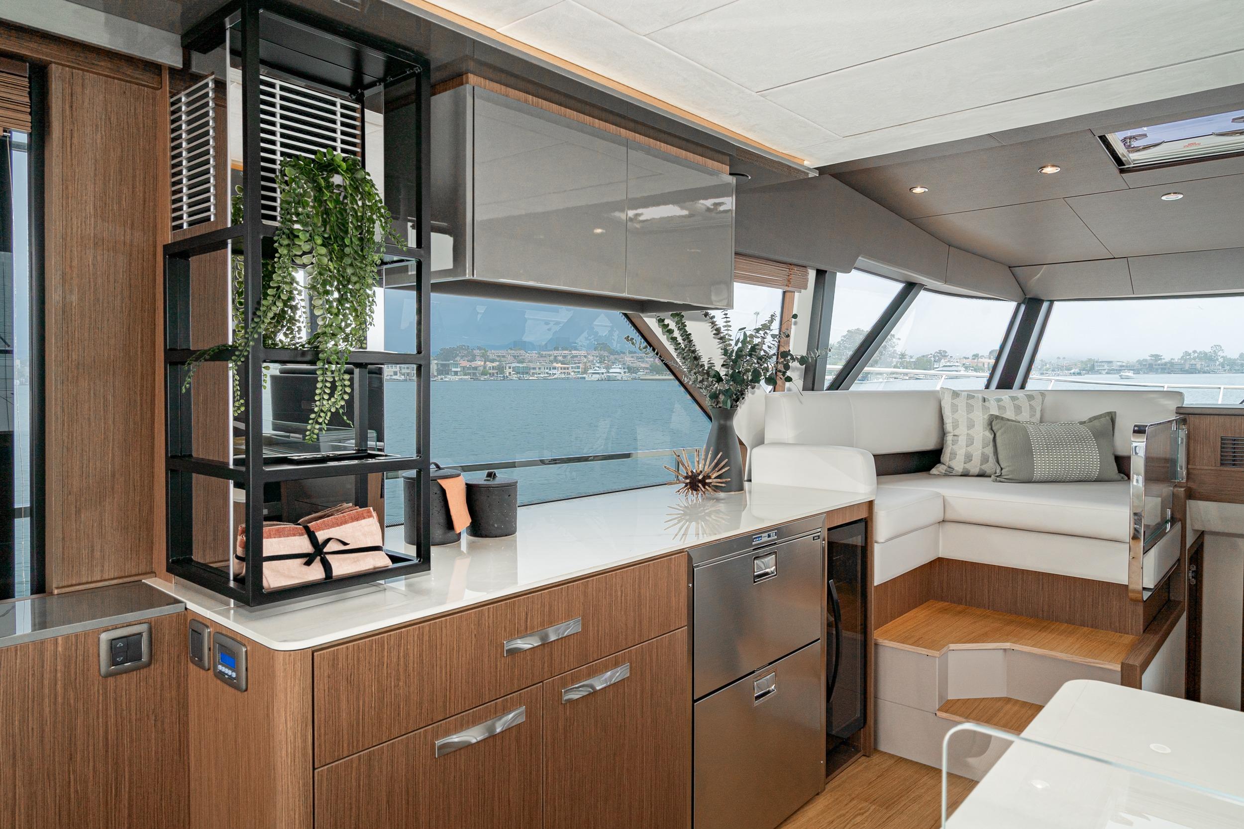 Luxurious interior of 2024 Prestige X60 yacht with modern design and scenic views.