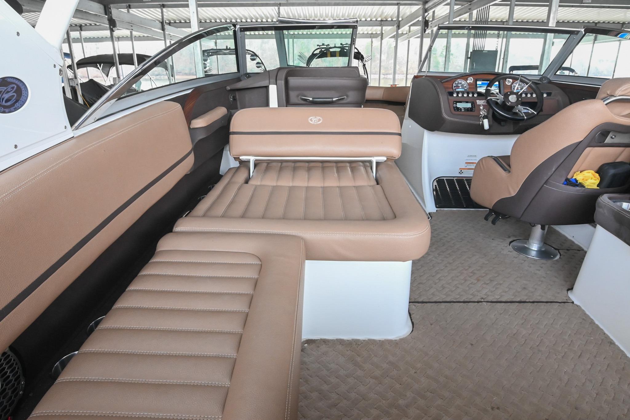 2015 Cobalt R7 boat interior with tan leather seating and modern dashboard.