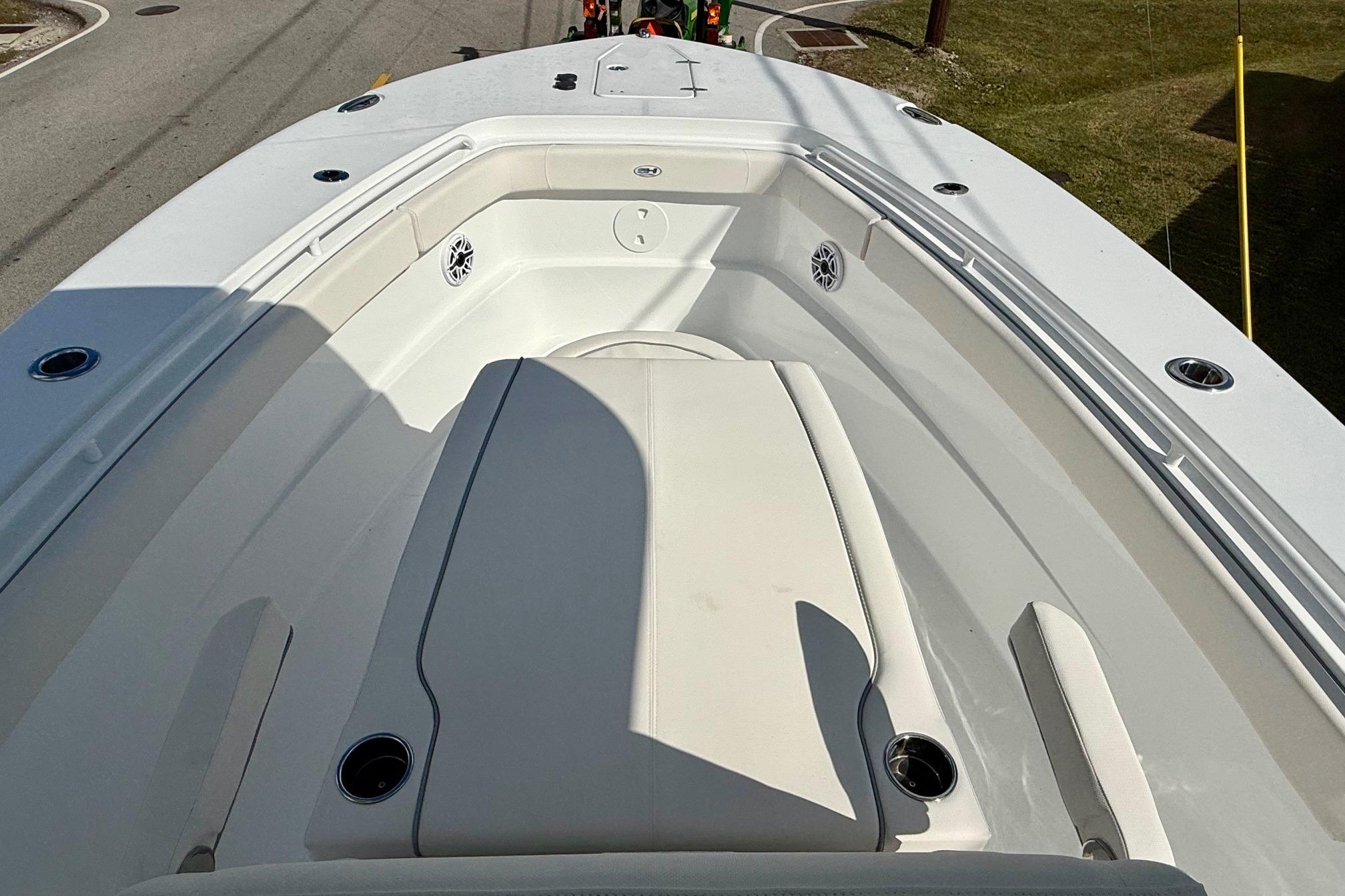2026 Sea Hunt Ultra 285 Coffin Box boat interior with seating and cup holders.