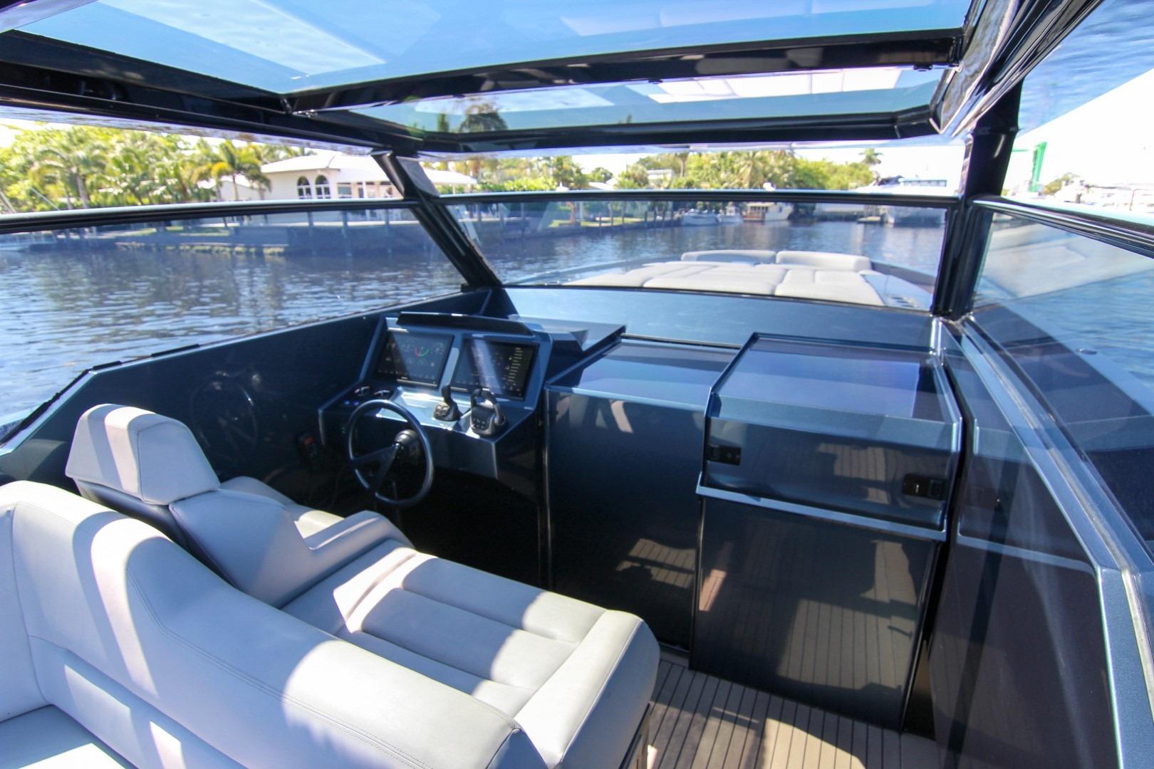 Interior view of 2022 Vanquish Yachts VQ45 with modern helm and seating.