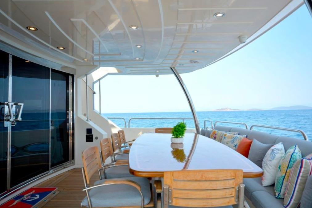 Luxurious Sunseeker 30 Metre Yacht 2011 with elegant outdoor dining area and ocean view.