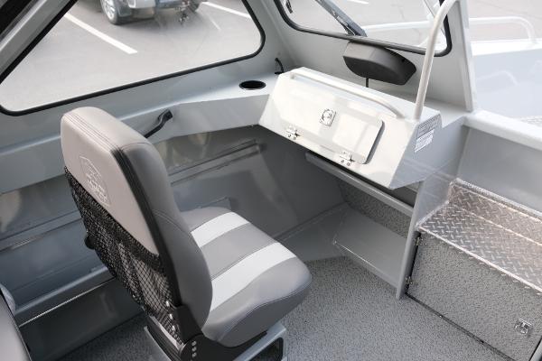Interior of 2024 Hewescraft 180 Pro-V ET boat with seating and storage.